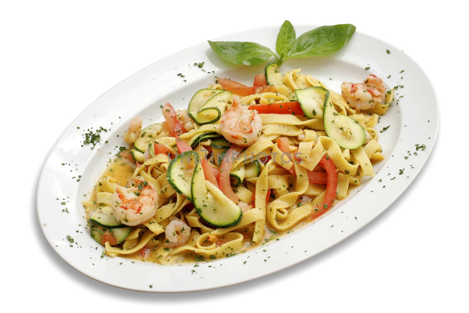 Pasta with shrimps and zucchini. Italian kitchen. White isolated with path.
