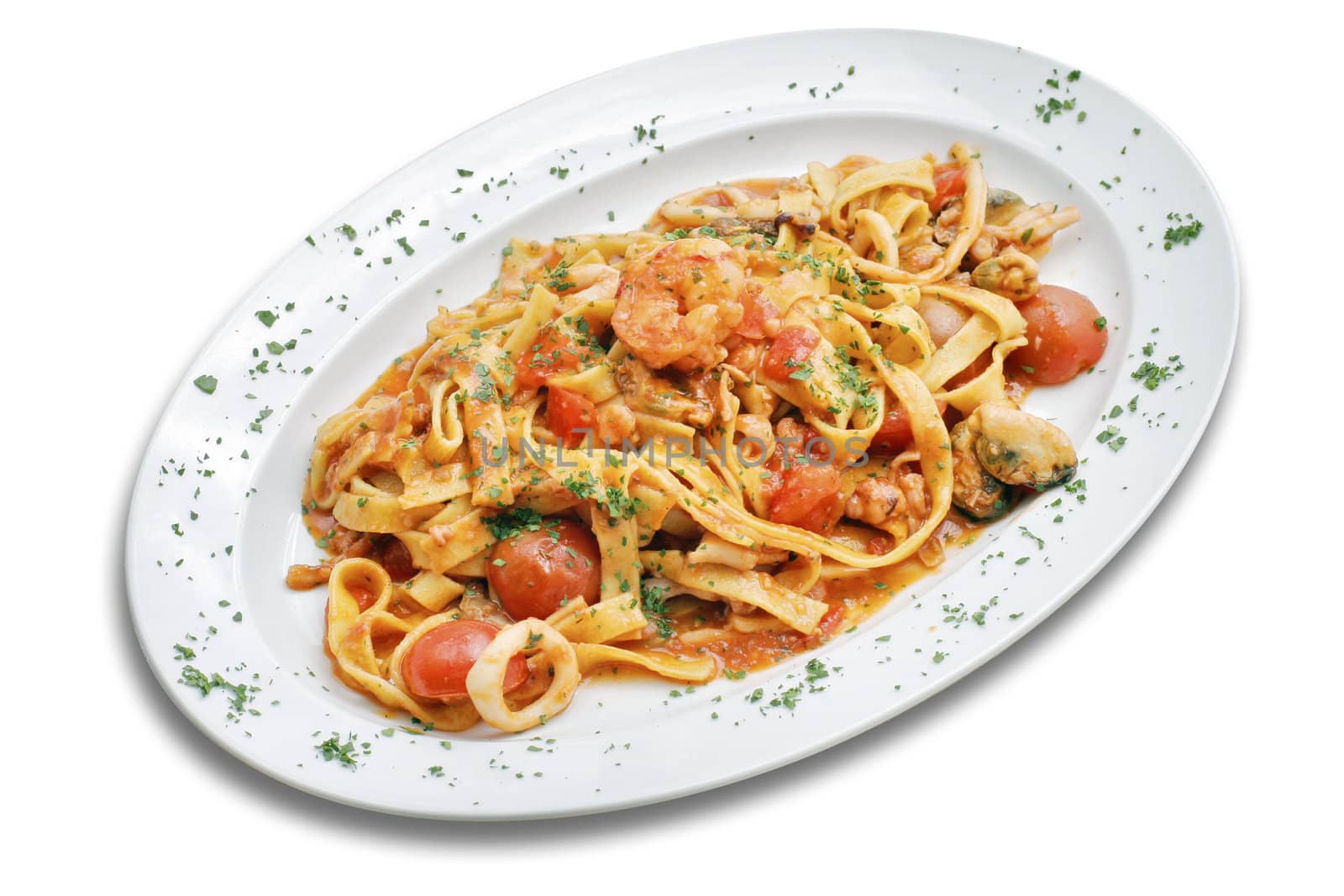 Pasta with seafoods and cherry tomato.  White isolated with path.
