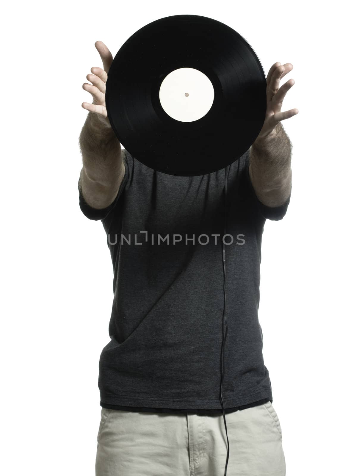 Man isolated on a white background is showing off an old lp record.