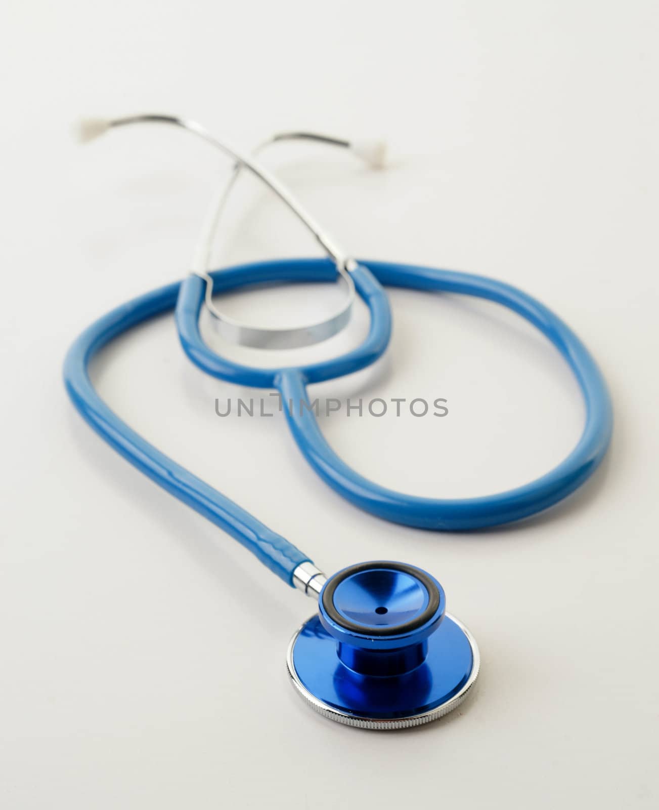 great image of a blue stethoscope on white