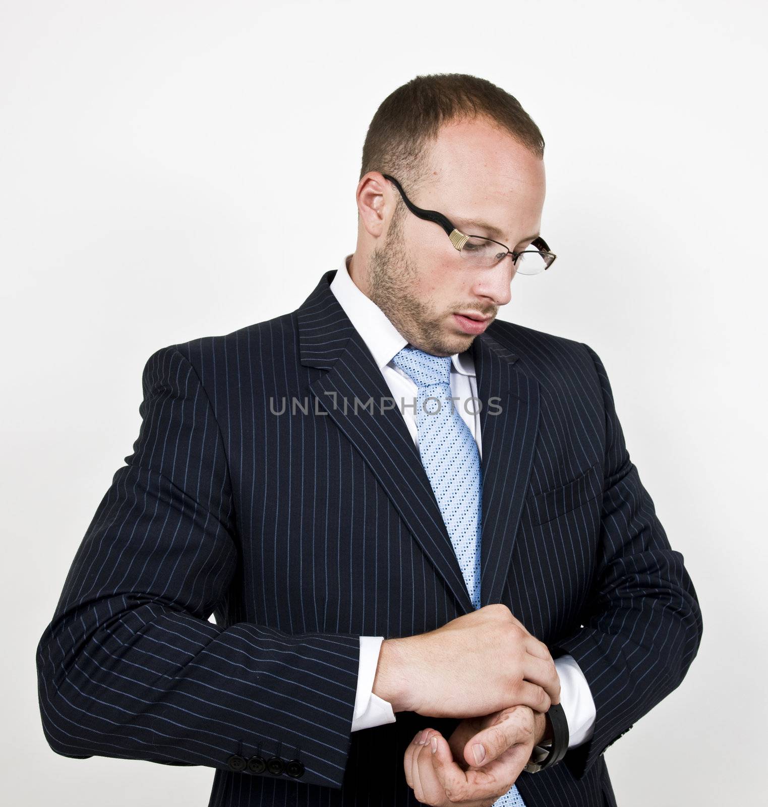businessman wearing the watch on isolated background

