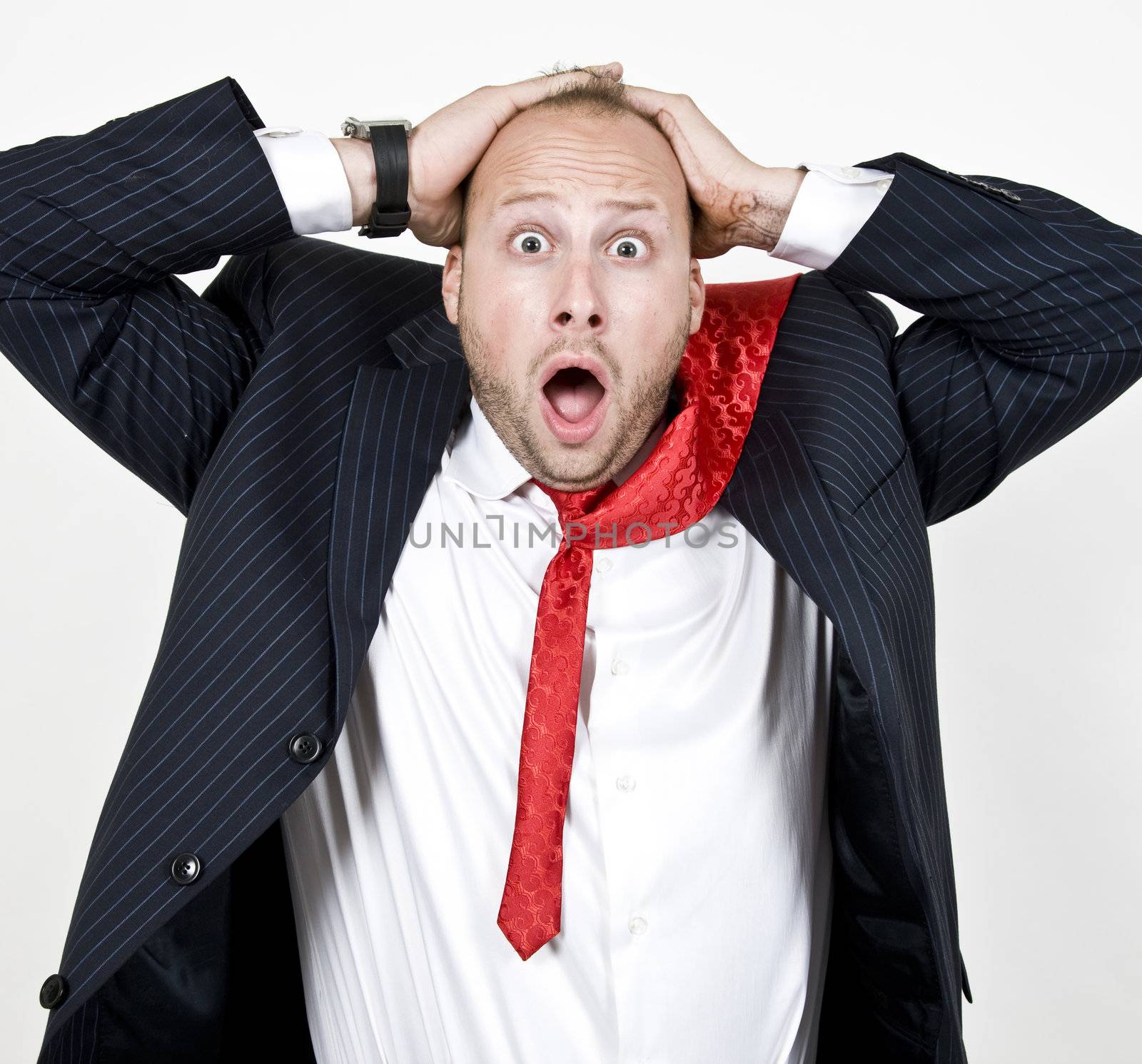 amazed businessman on isolated background
