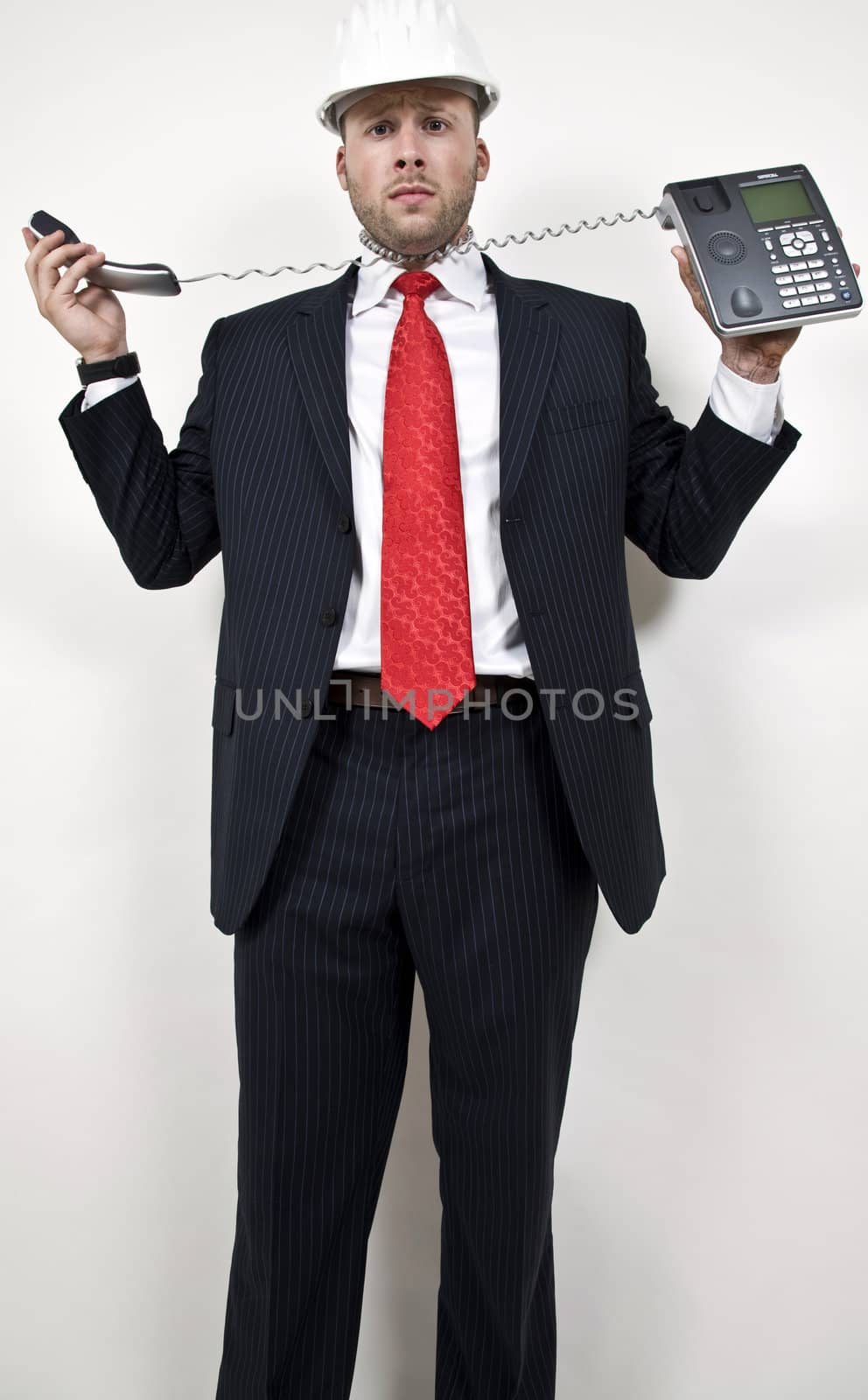 male with wired phone on isolated background
