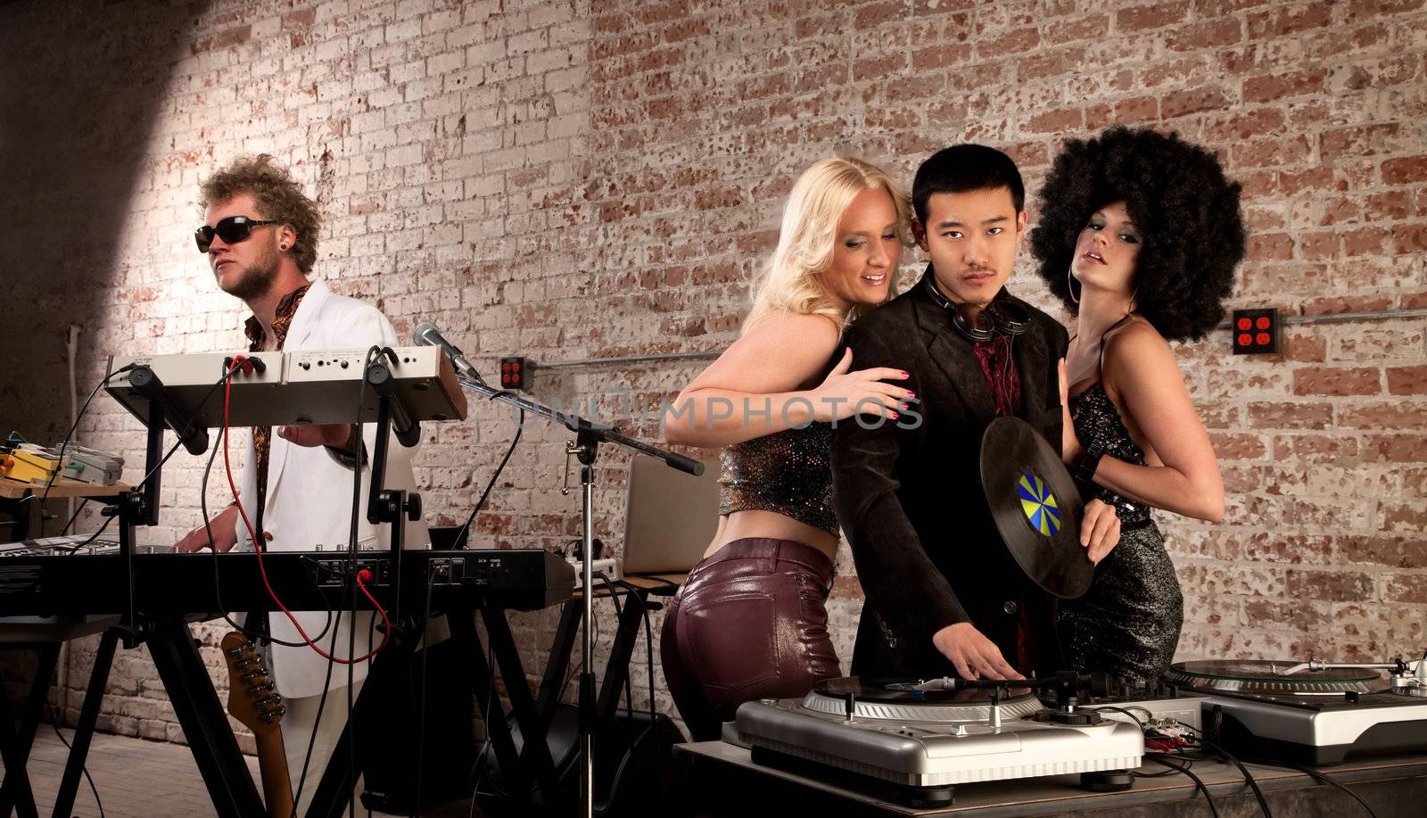 Mac Daddy DJ with Ladies at a 1970s Disco Music Party