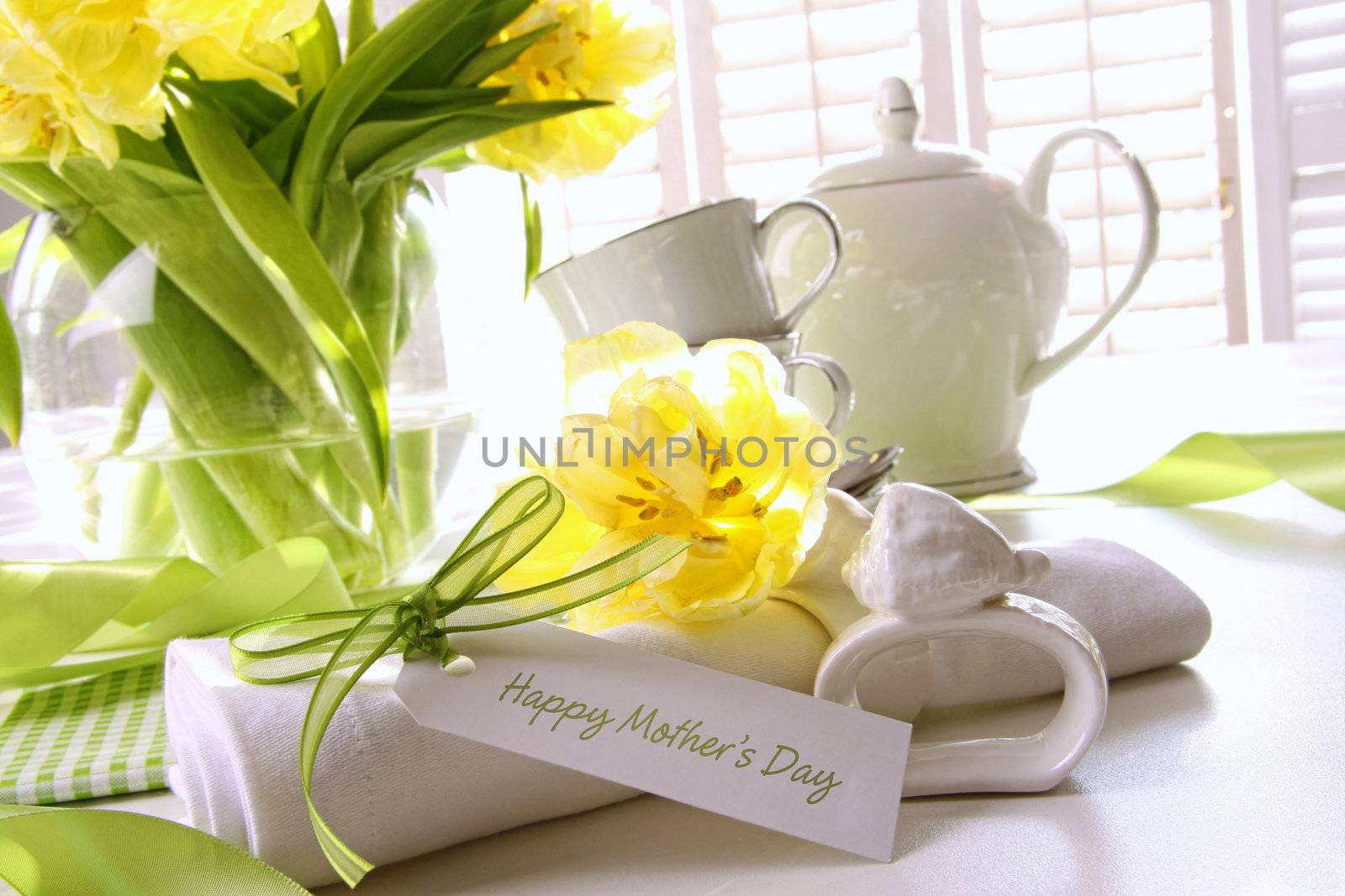 Gift card for mother's day on table with flowers