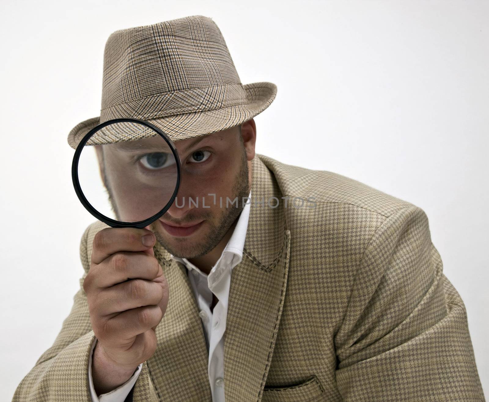 spying man with magnifying glass on isolated background

