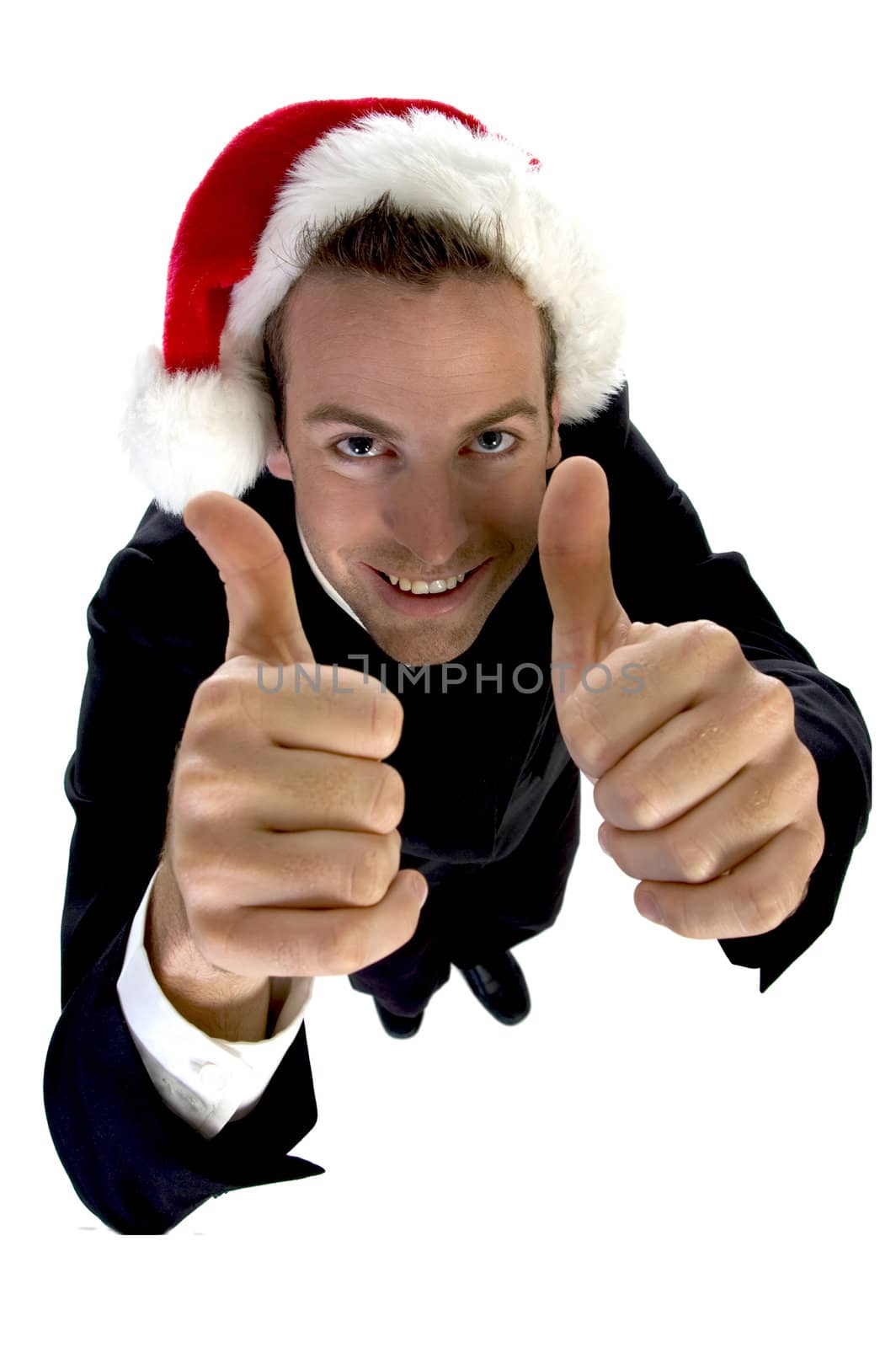 businessman cheering with santa cap against white background