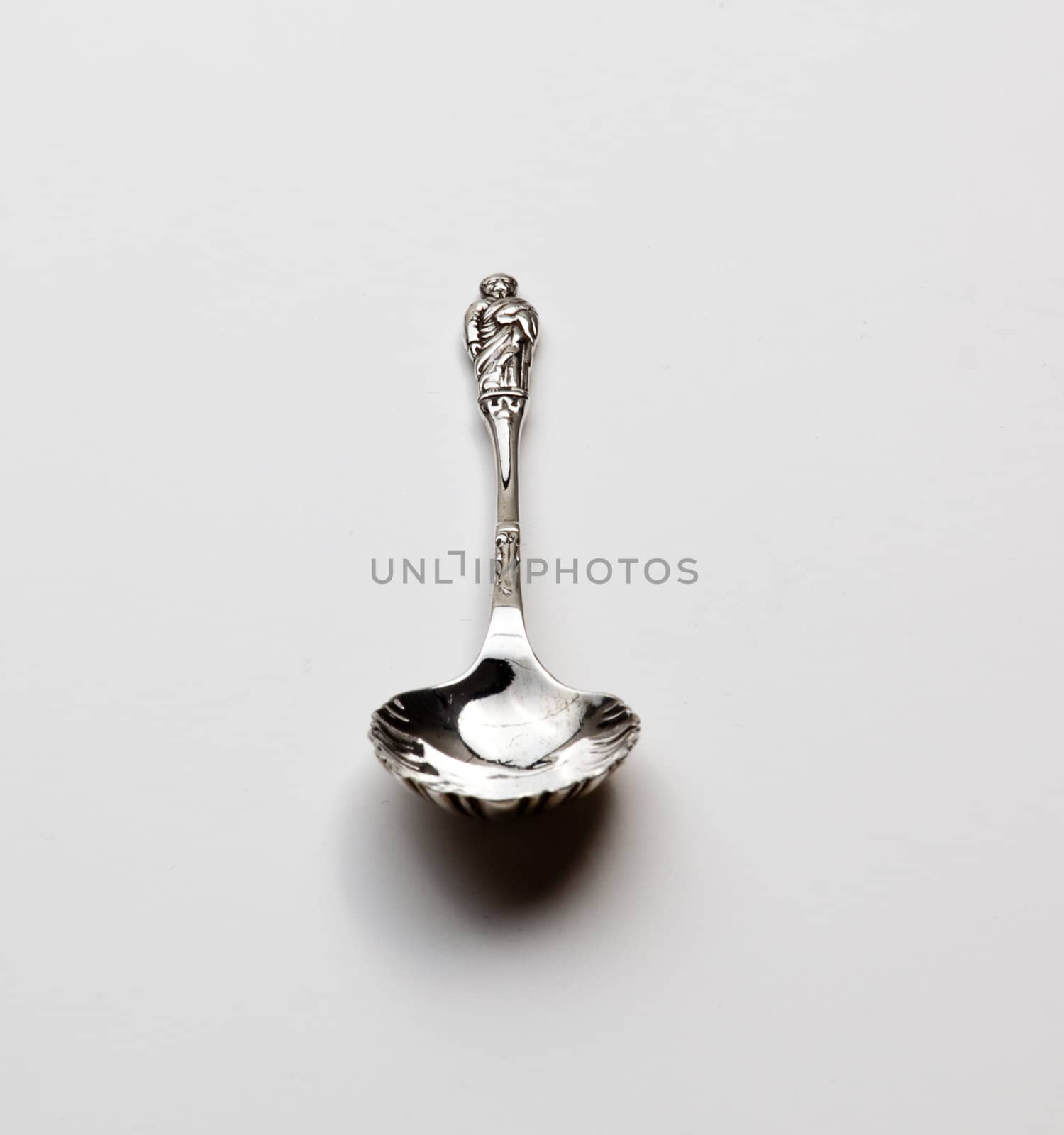 Old fashioned sterling silver object being an apostle statue spoon