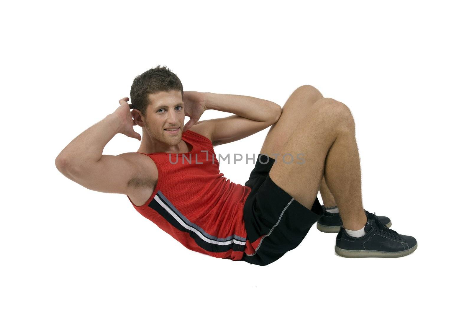 exercising handsome man on isolated background