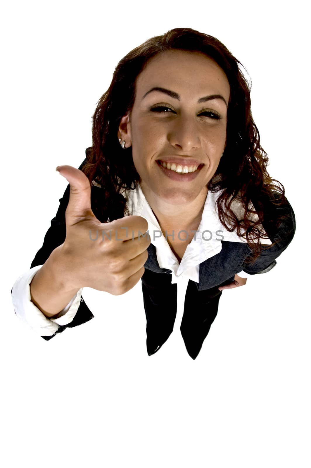 female showing thumb looking upward against white background