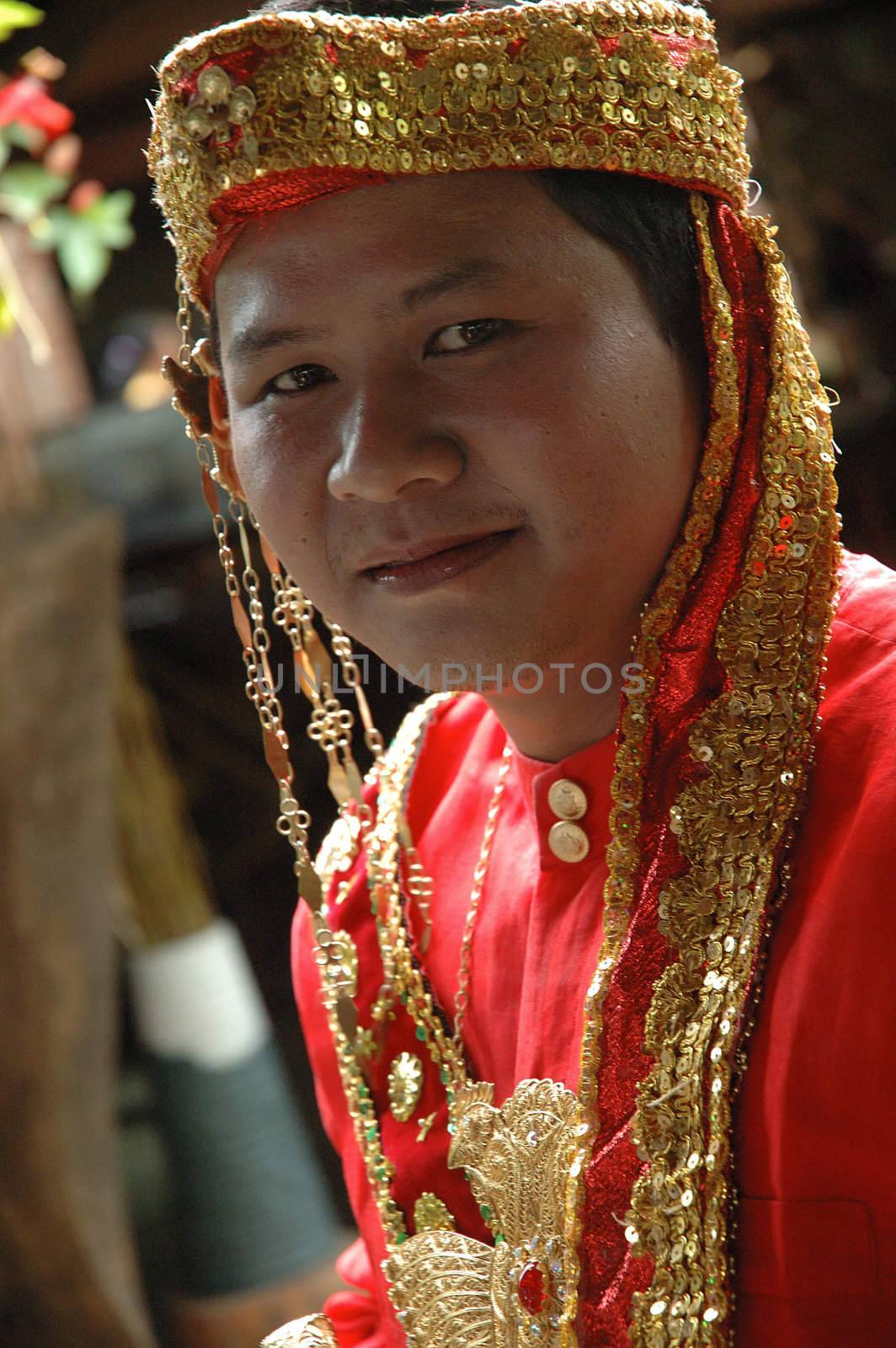 young asian groom wearing traditional costume from makasar-indonesia