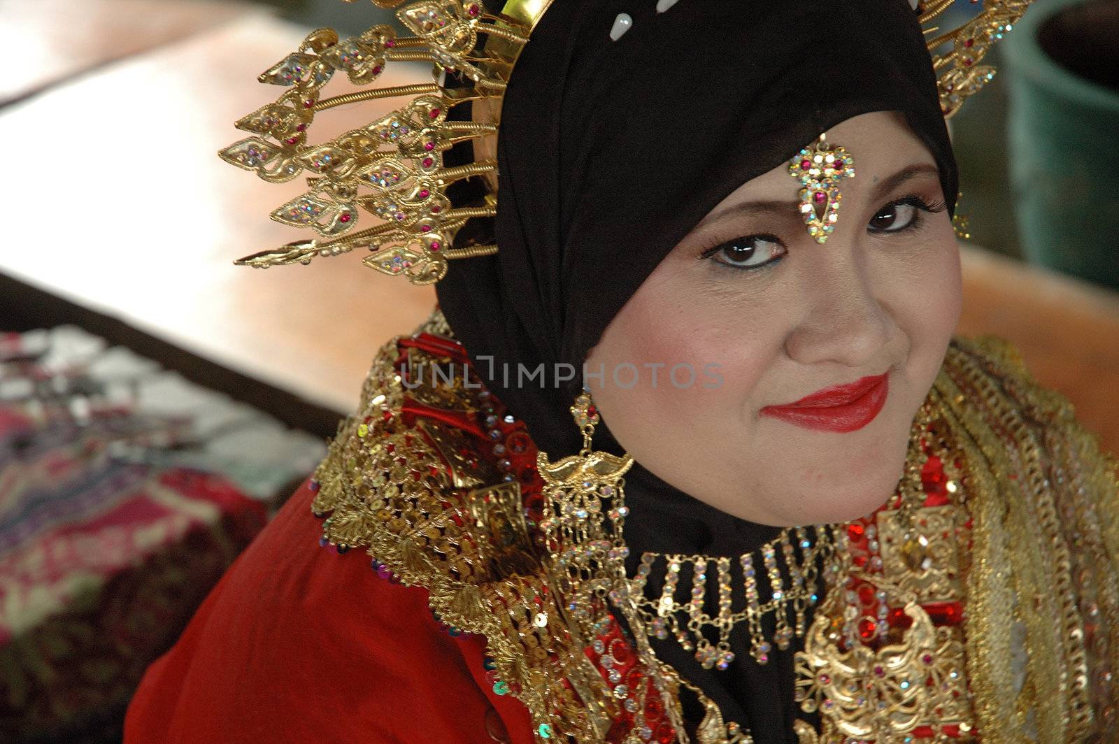 young asian bride wearing traditional costume from makasar-indonesia