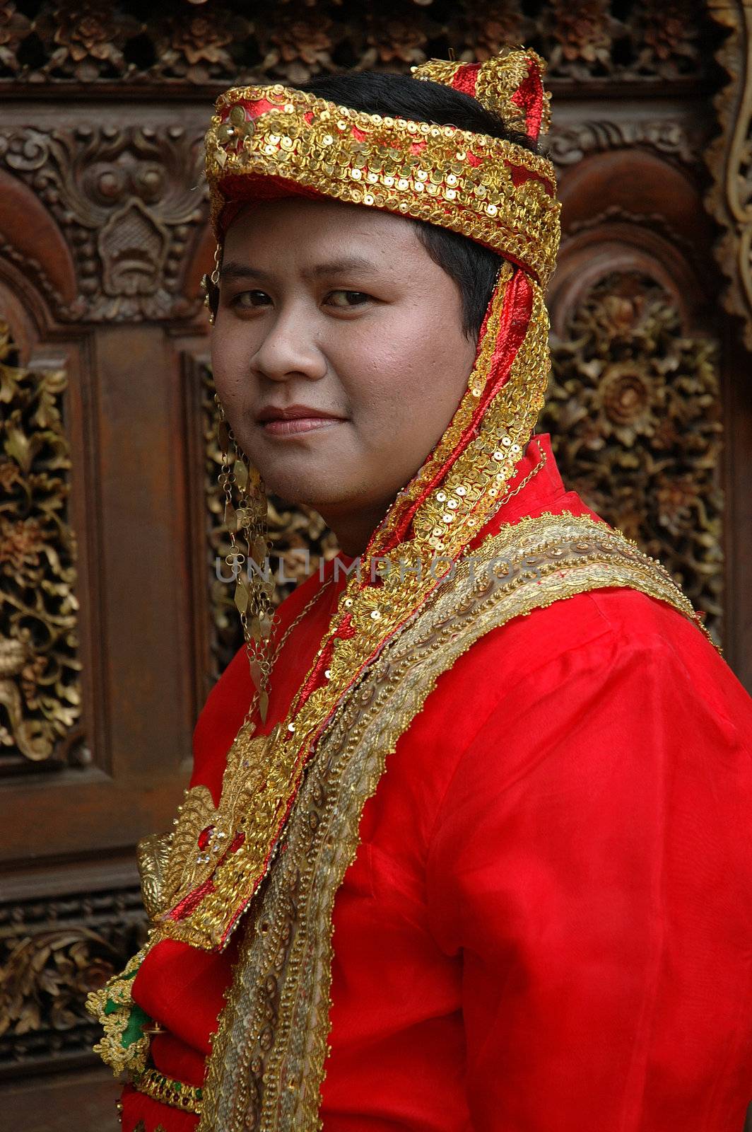 young asian groom wearing traditional costume from makasar-indonesia