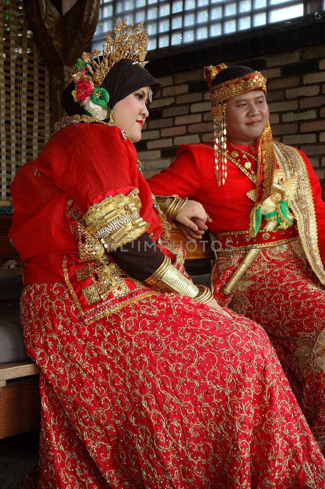 bride and groom wearing traditional costume from makasar-indonesia