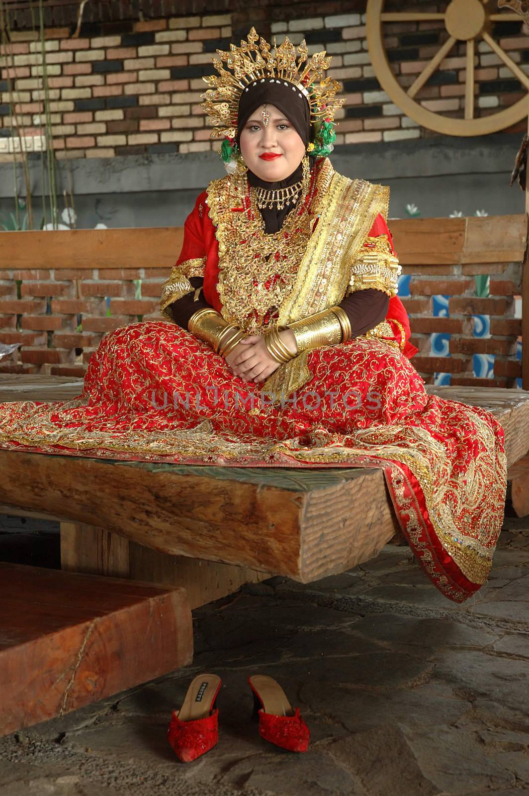 young asian bride wearing traditional costume from makasar-indonesia