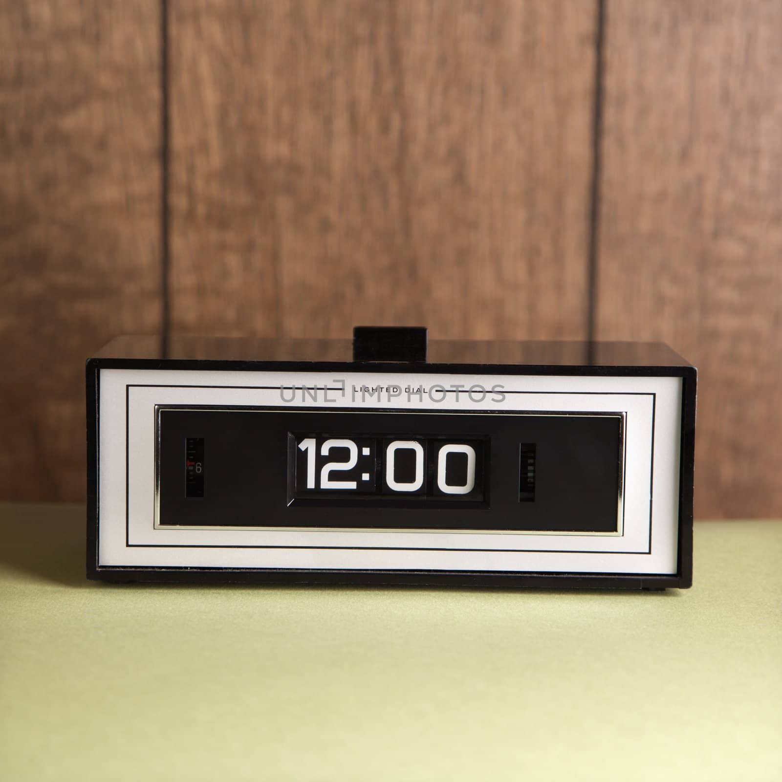Retro clock set for 12:00. by iofoto