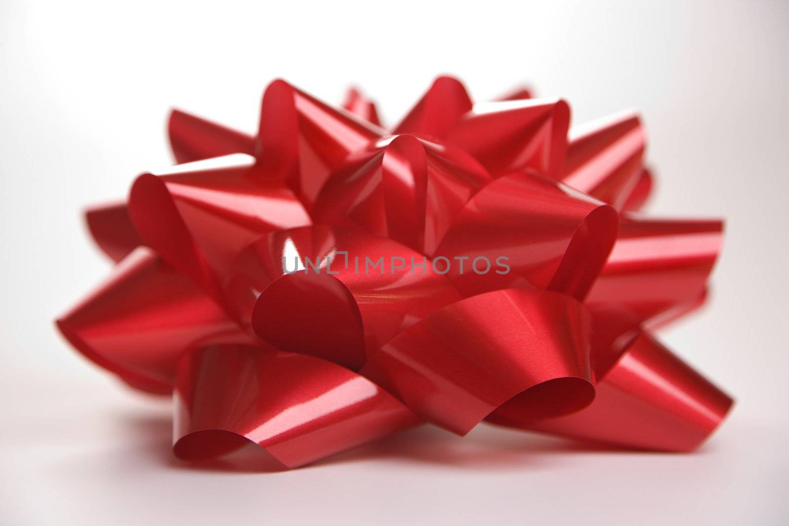 Still life of big red Christmas bow.