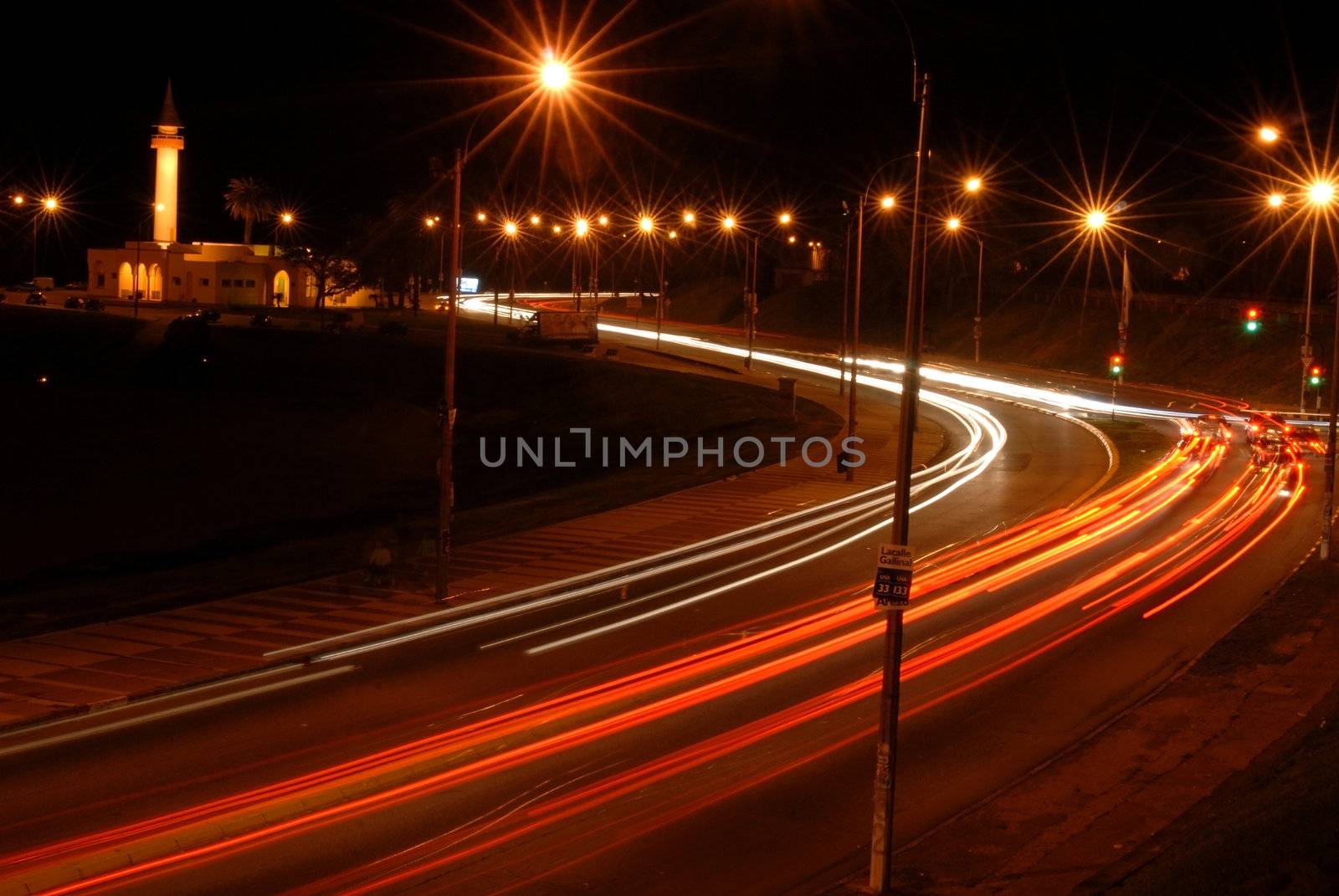 Cars at night with motion blur by cienpies