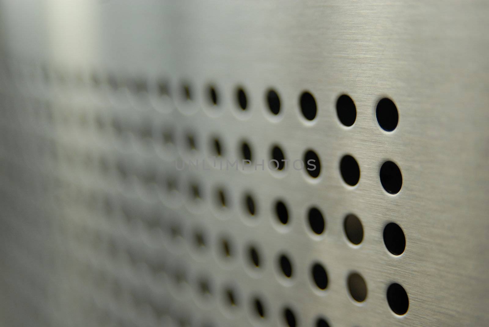 Aligned perforations on metallic surface