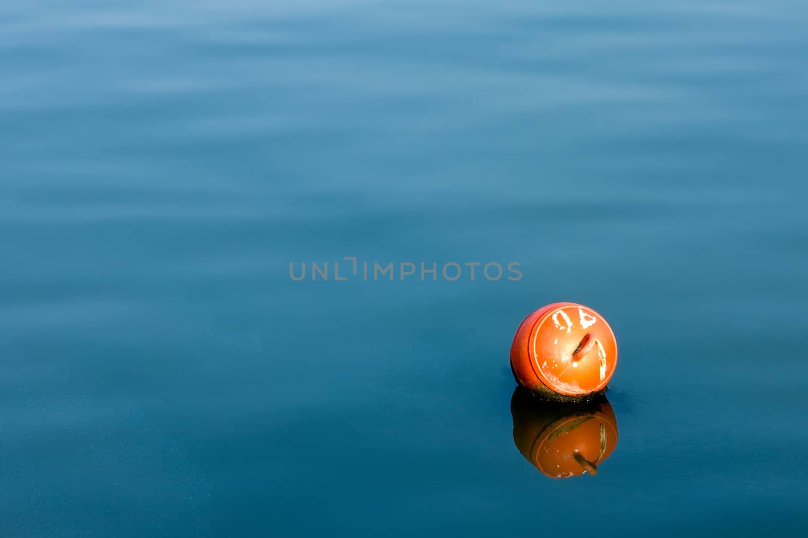 Buoy on a blue water