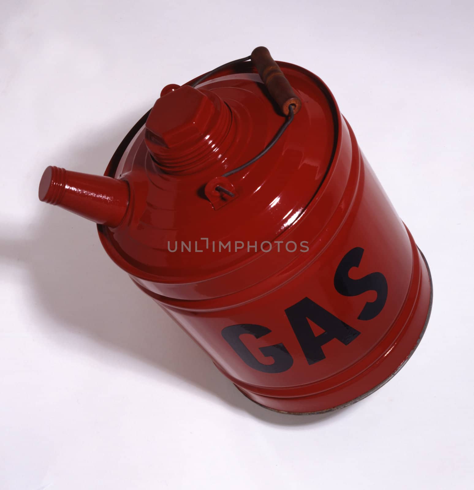 Red metal gas can on white background
