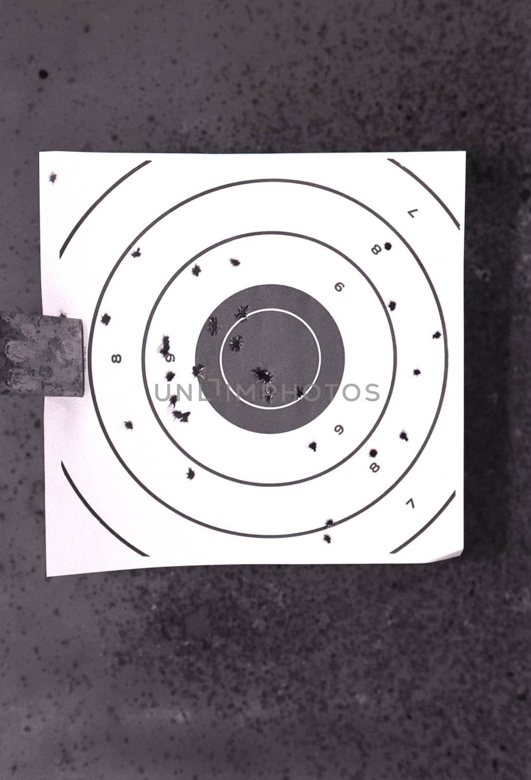 Bullseye target with bullet holes
