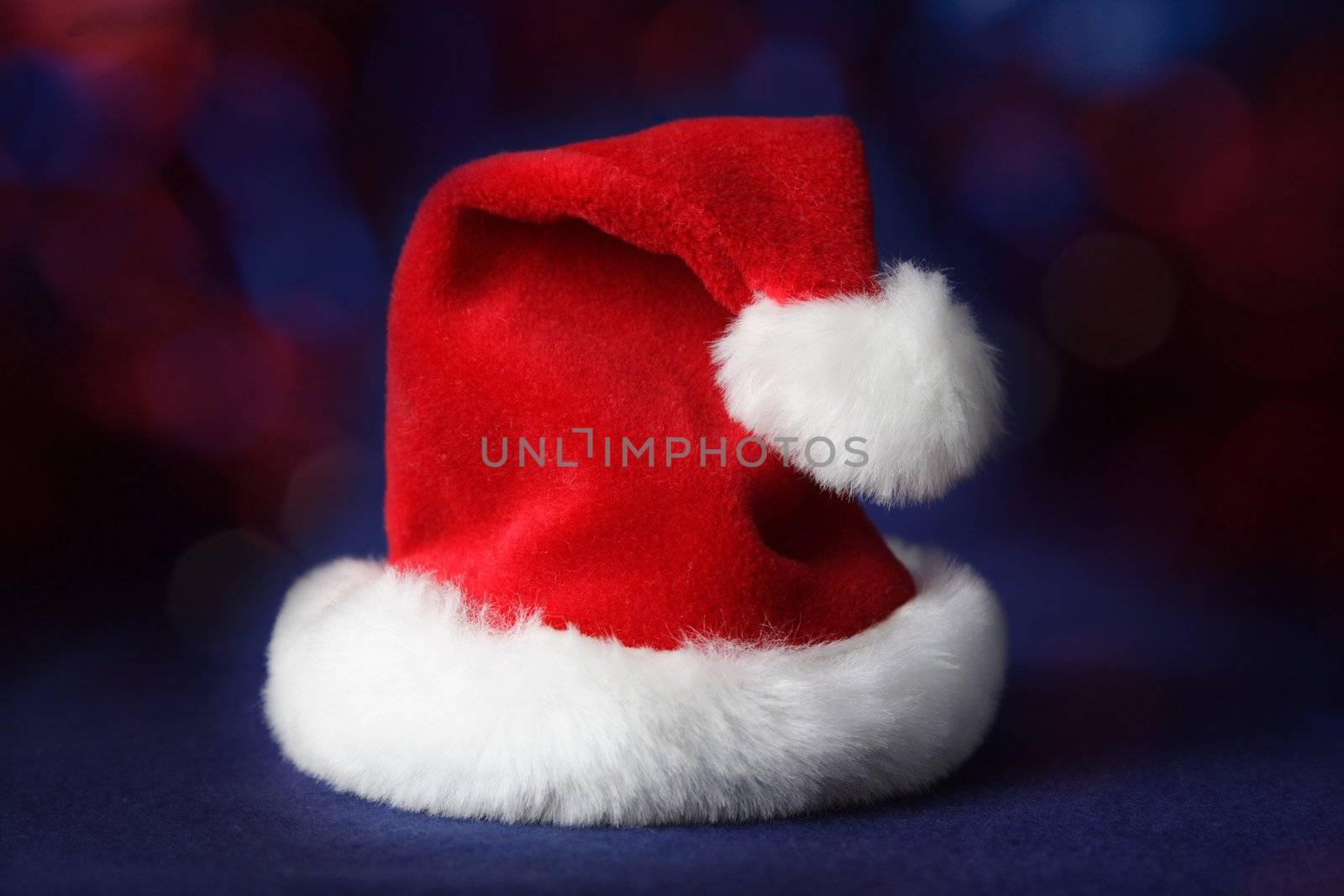 red Santa Christmas hat, blue background