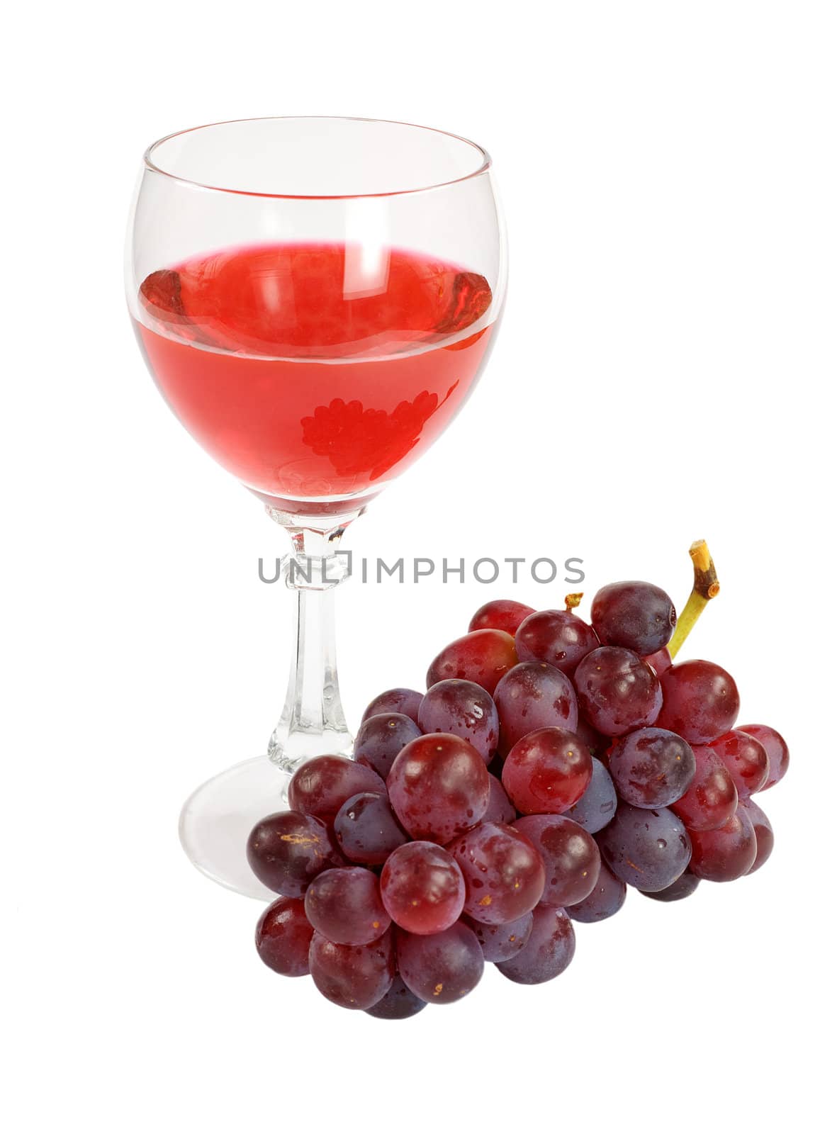 Glass of red wine and grapes cluster on a white background