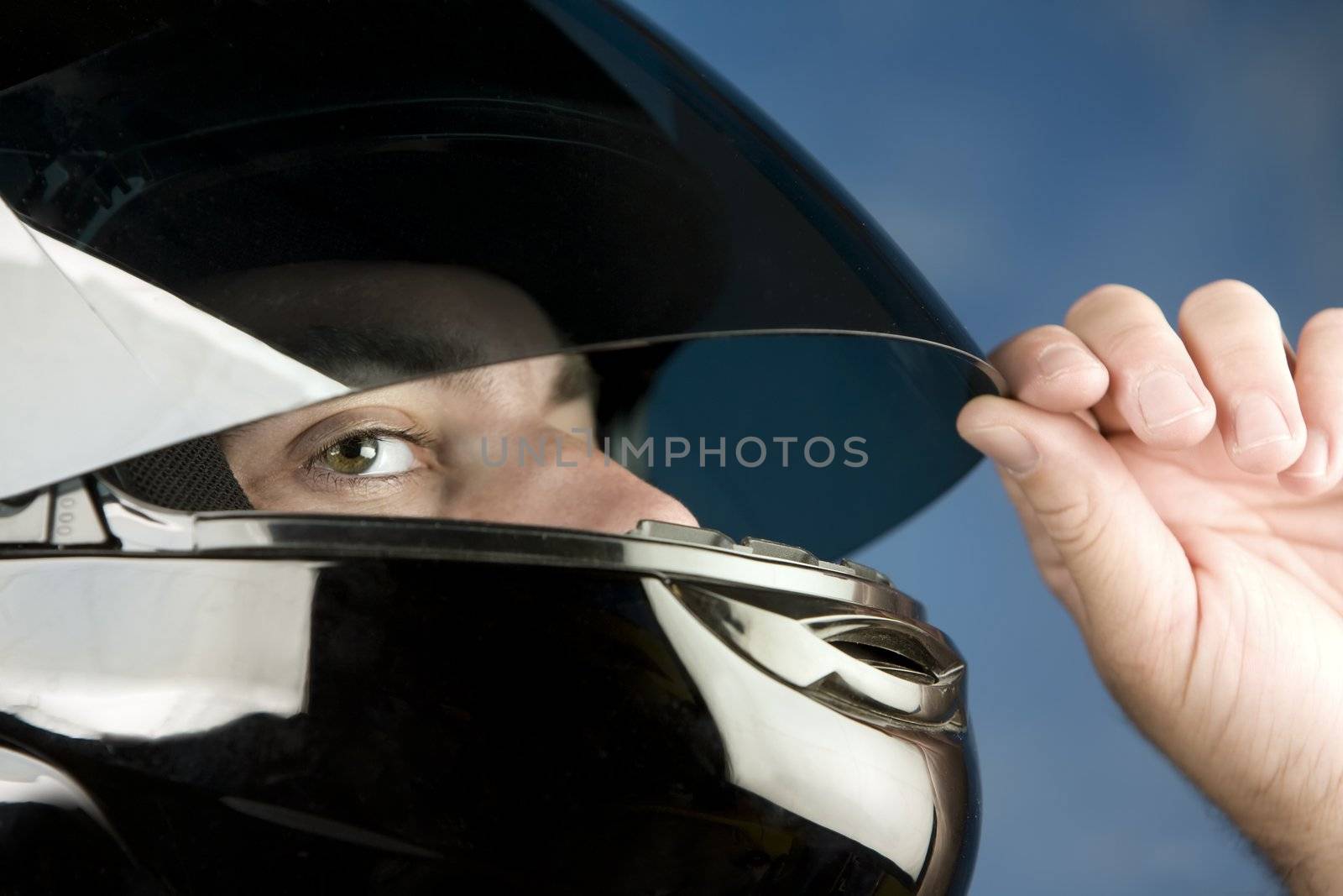 Close-up of a man wearing a motorcycle helmet