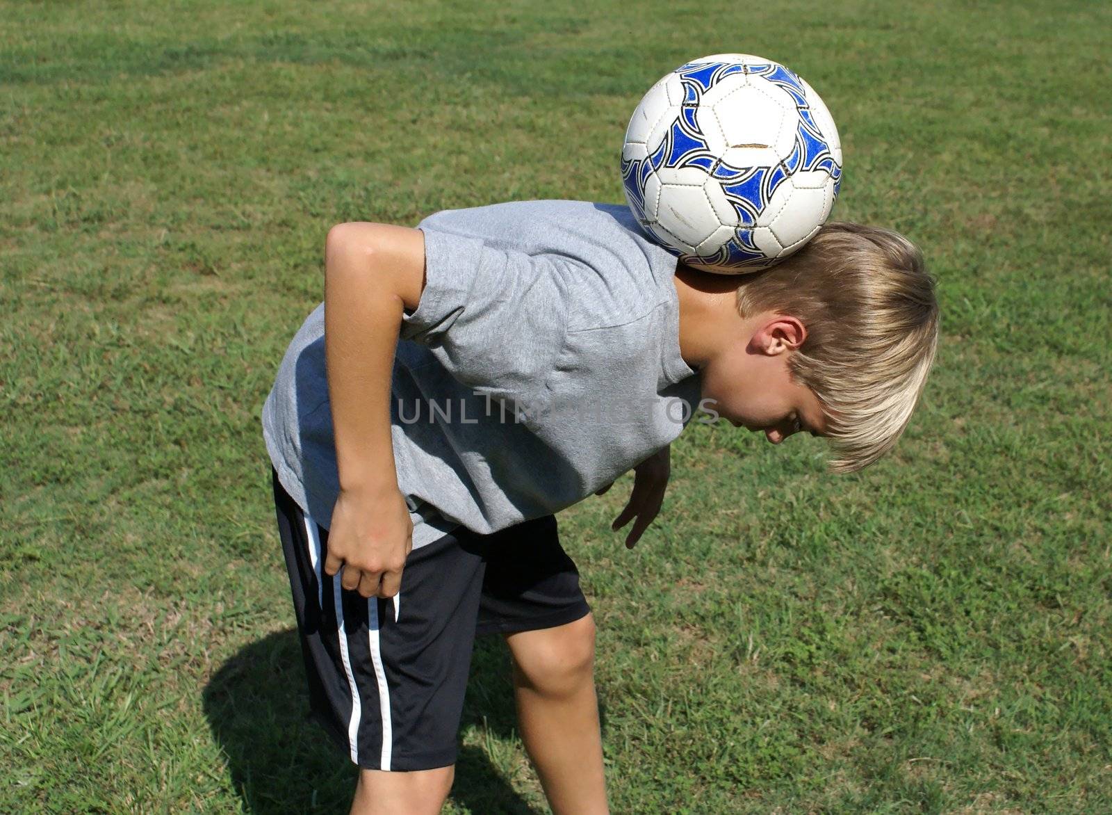 11 year old boy in South Carolina performing a juggling trick.