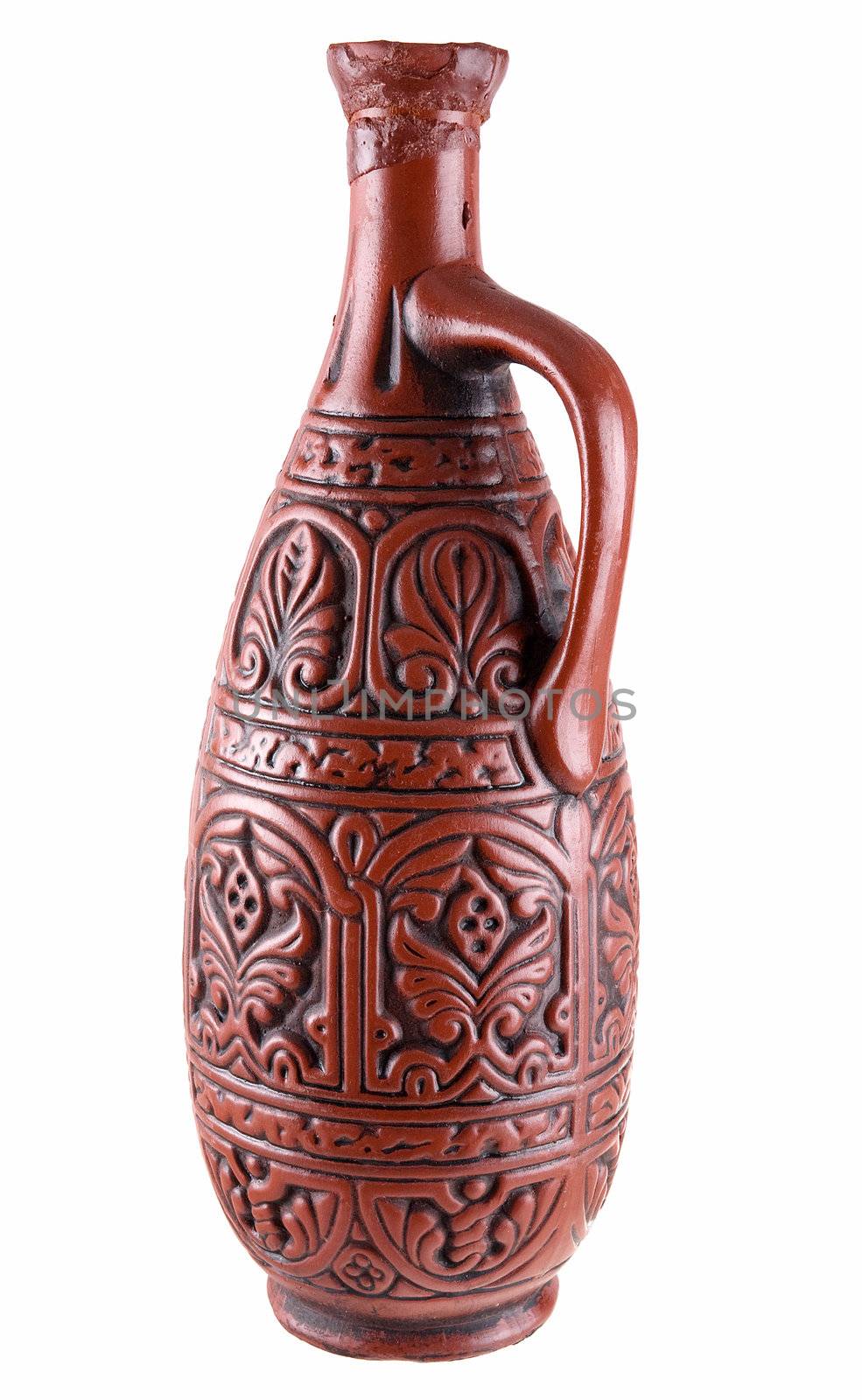 Dark brown clay jug on a white background