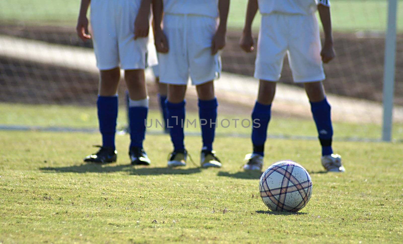 Boys setting up the wall for the penalty kick.              
