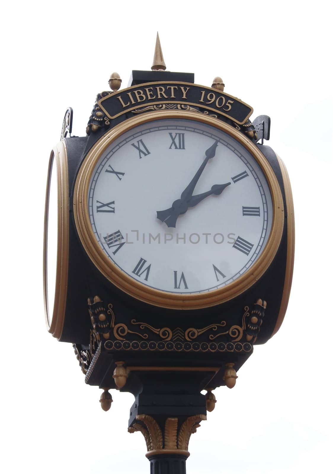 Clock tower in the middle of the day with a white background.               