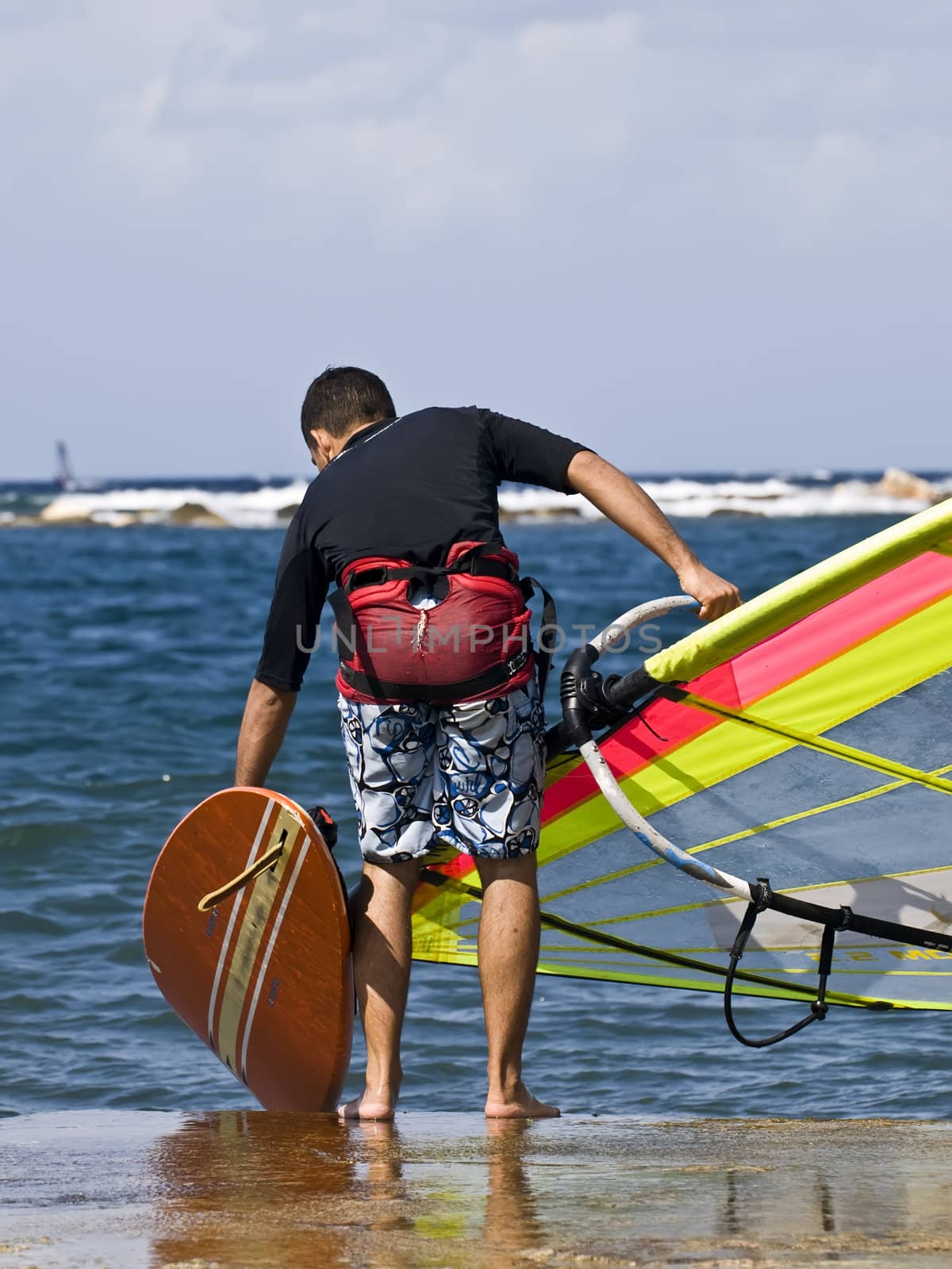 A young man getting ready to hit the waves