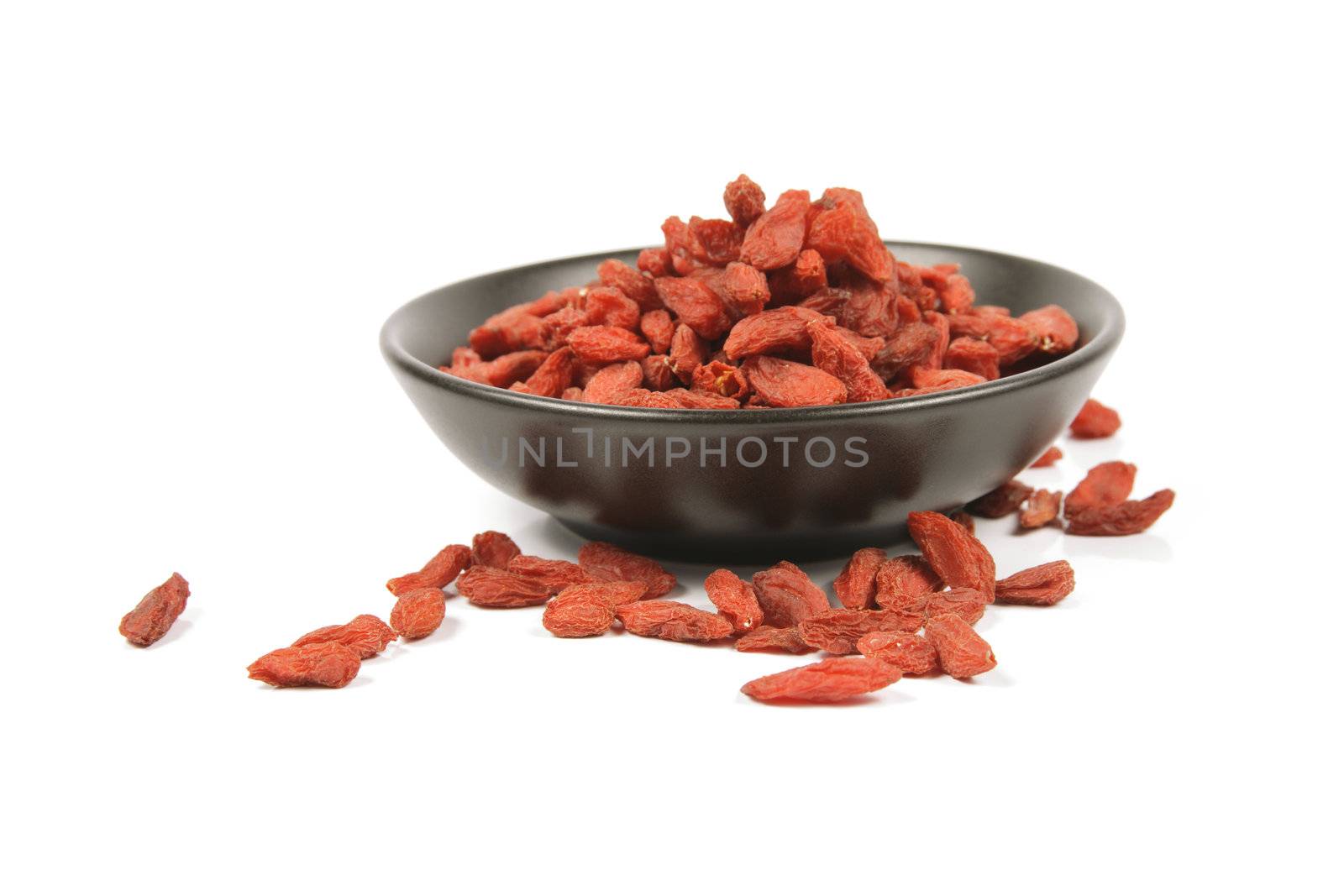 Goji Berries in a Black Dish by KeithWilson