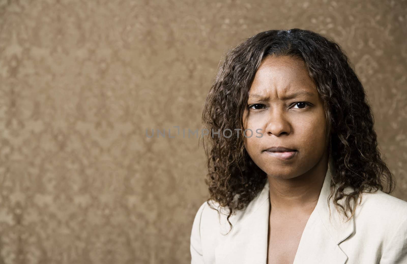 Close-Up Portrait of a Concerned Pretty African-American Woman 