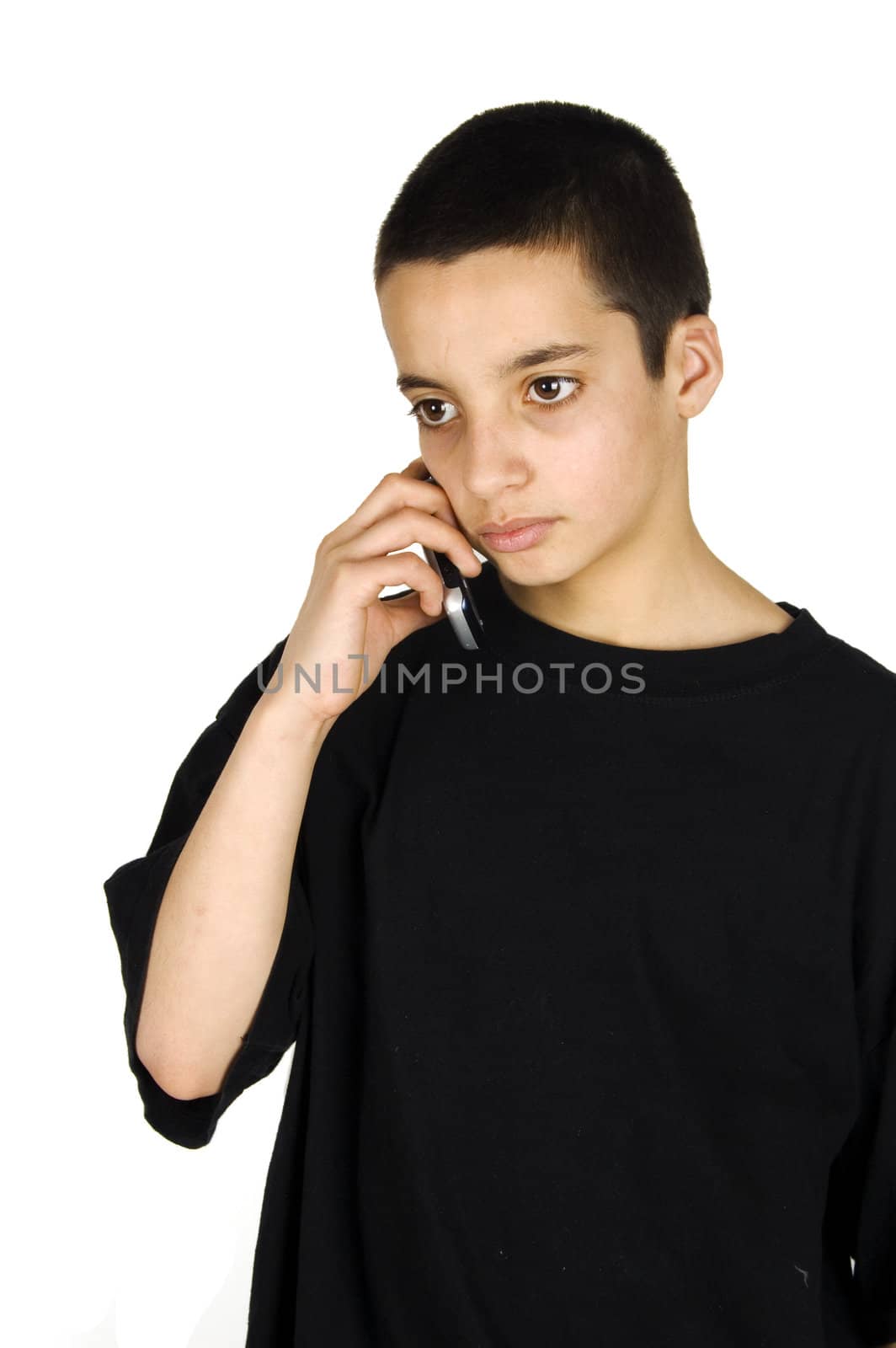 teenage boy in a serious conversation on his mobile