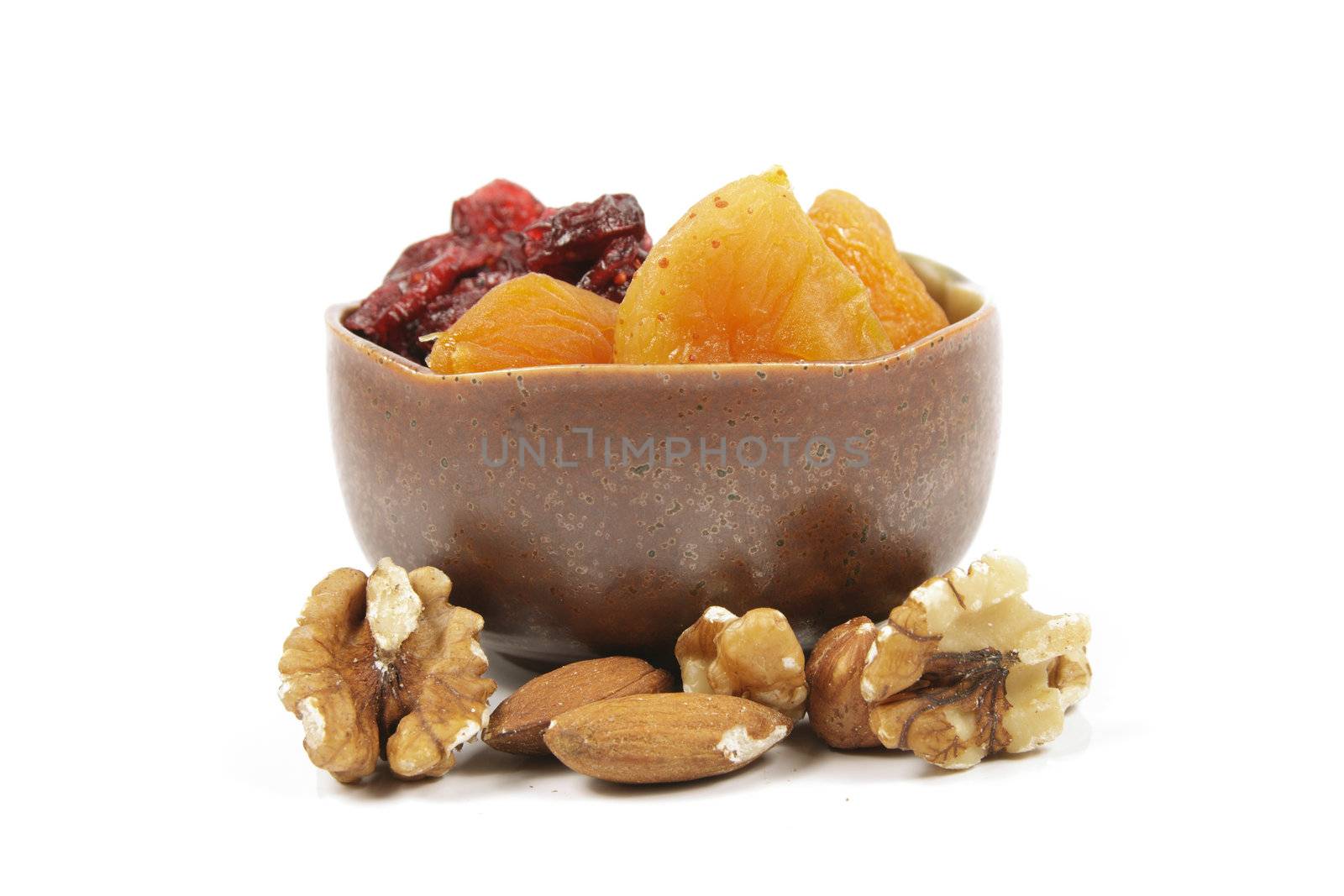 Red ripe dried cranberries on a reflective white background