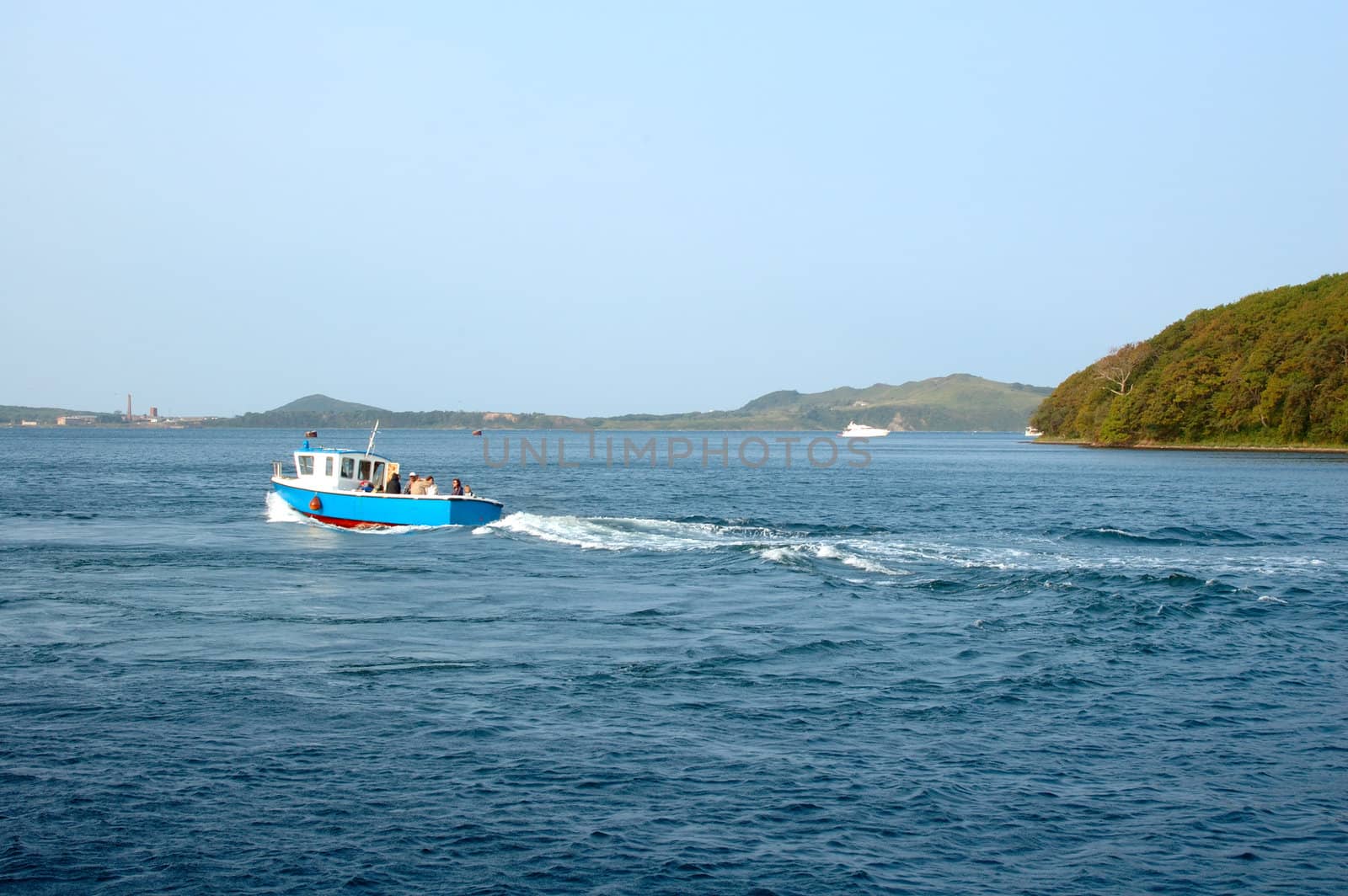 Sea scenery with blue motor-boat.