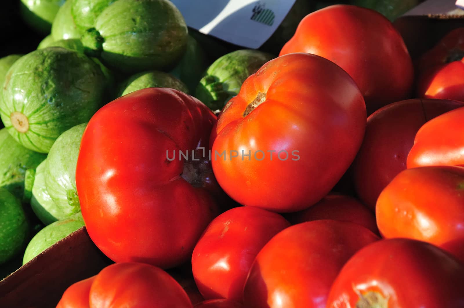 Bright red tomatoes in a farmer's market stall