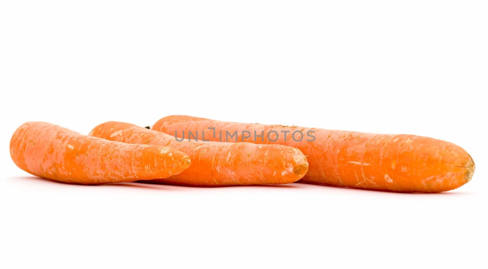 Three different carrots on a white background
