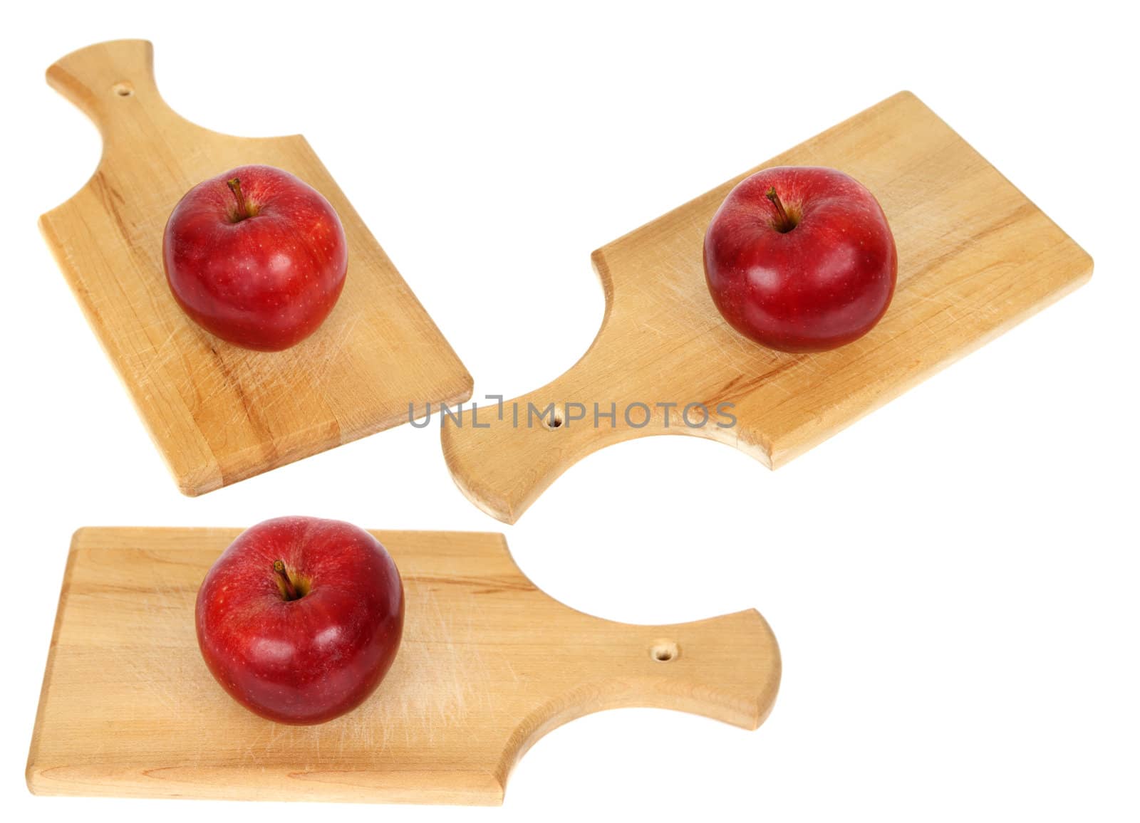 three red apple on wood planks, white background