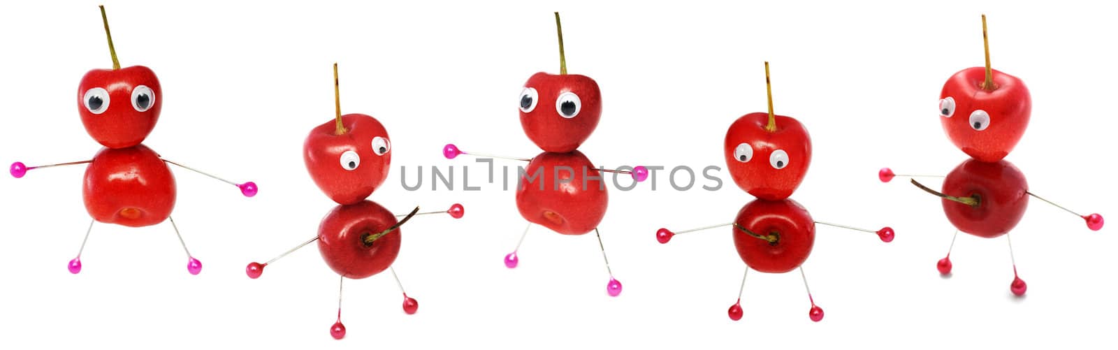 Five funny little men collected from a sweet cherry