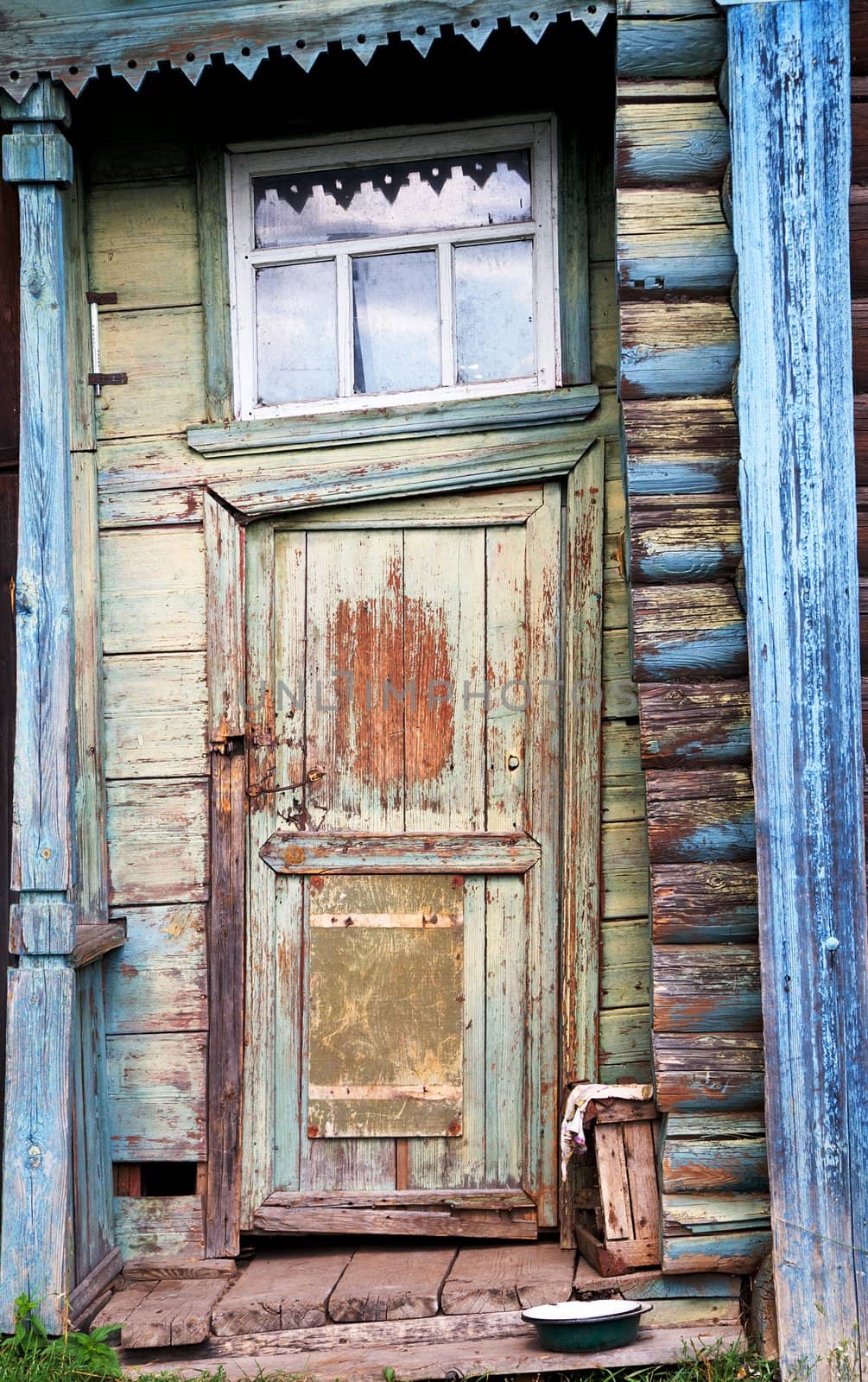Entrance door on a facade of the ancient house