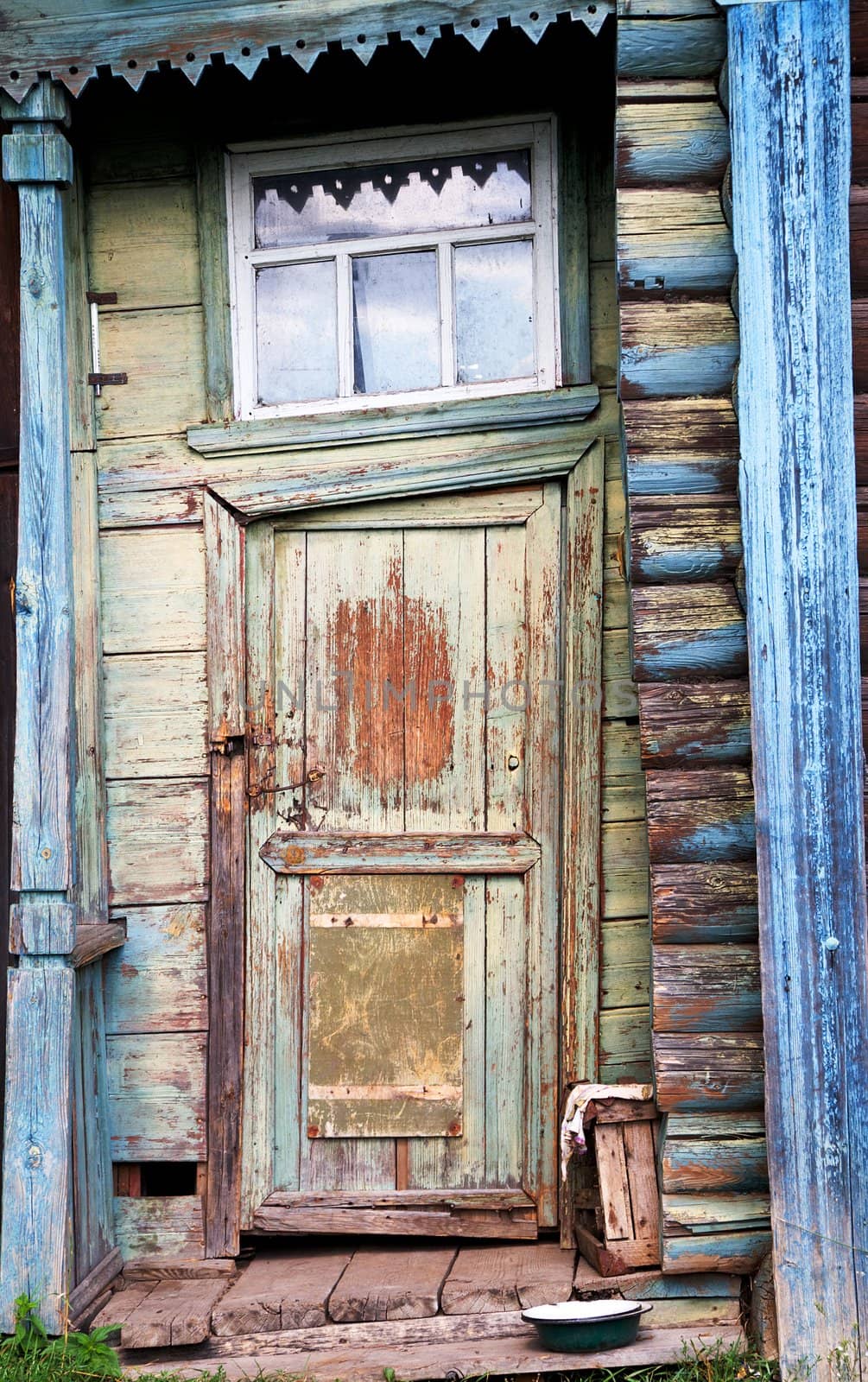 Entrance door on a facade of the ancient house