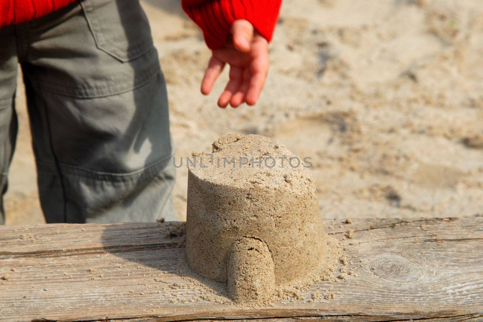 A child playing with the sand
