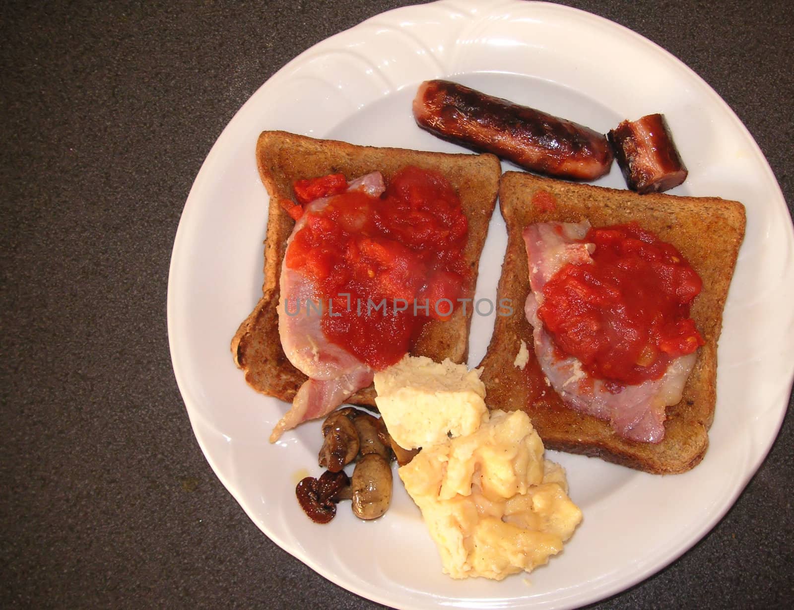cooked breakfast on two slices of wholemeal bread