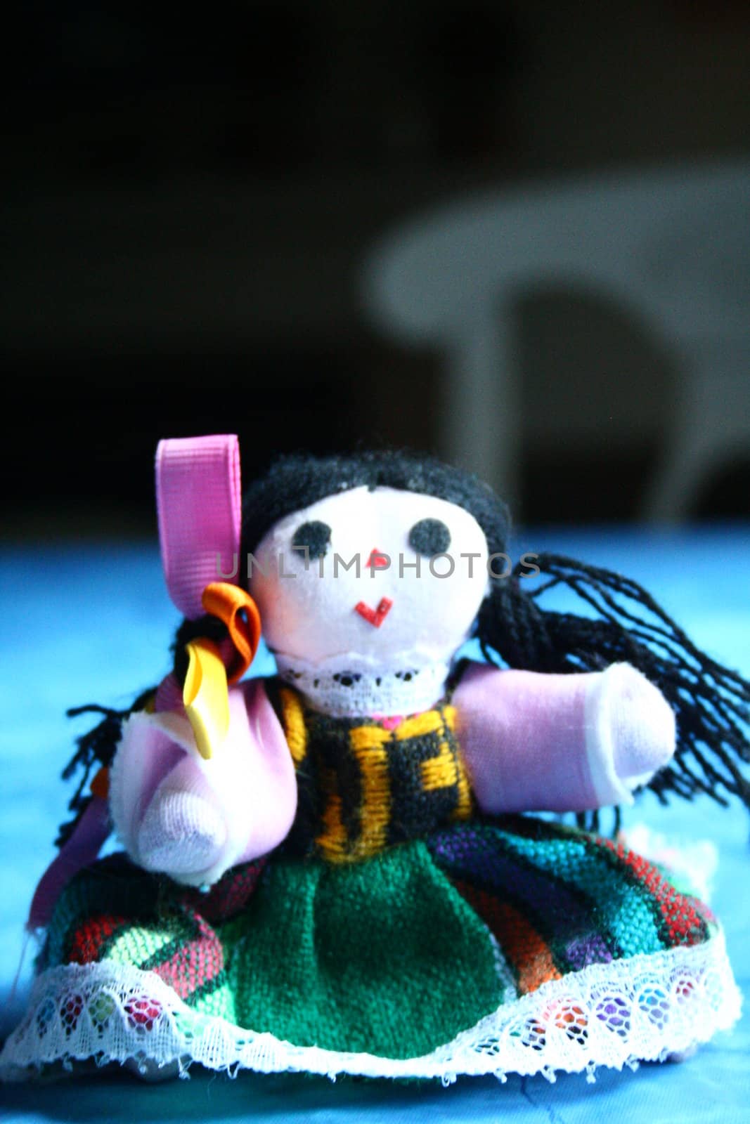 Small Mexican girl doll close up. 