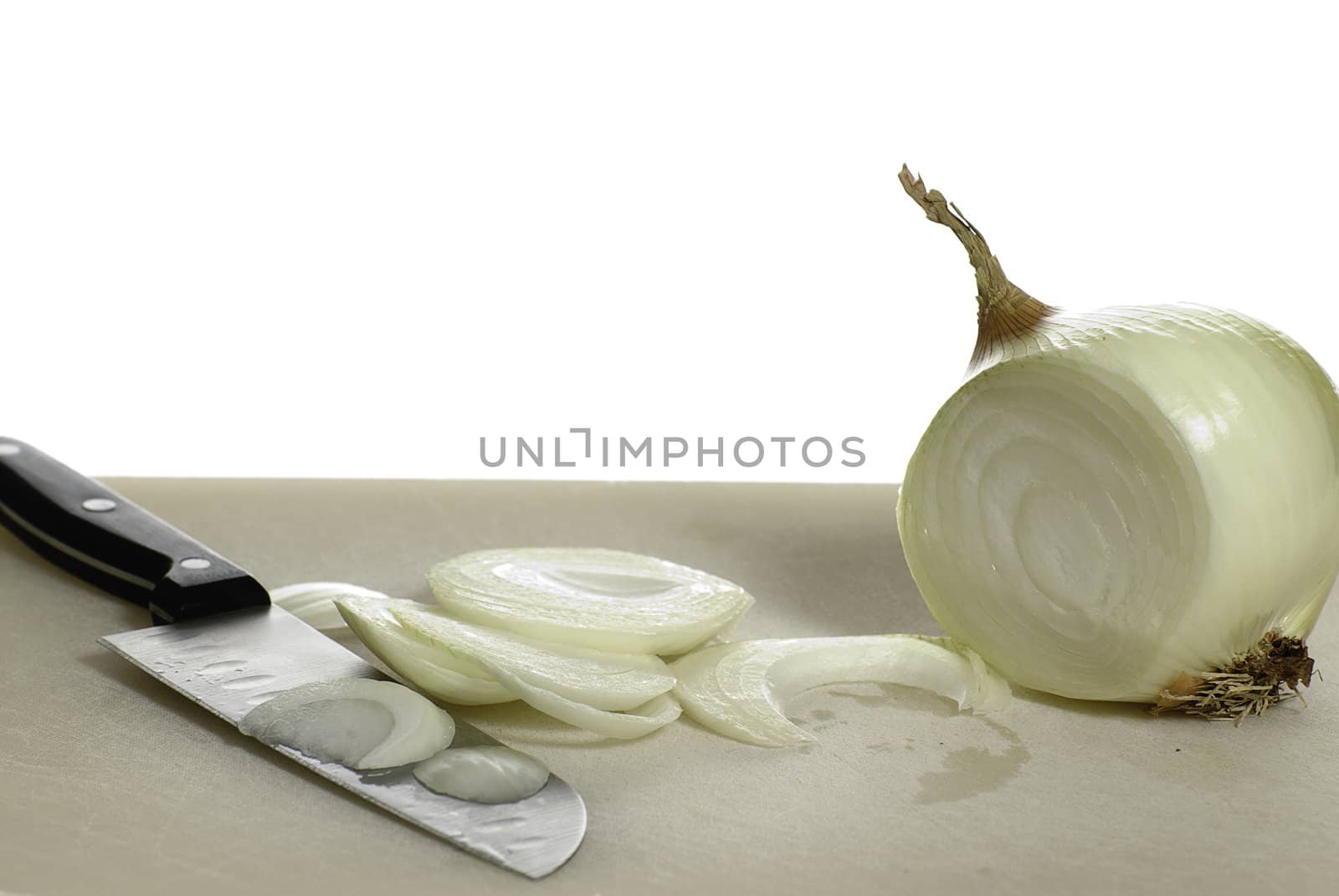 Kitchen prep involving the slice or cutting of an onion, isolated against a white background