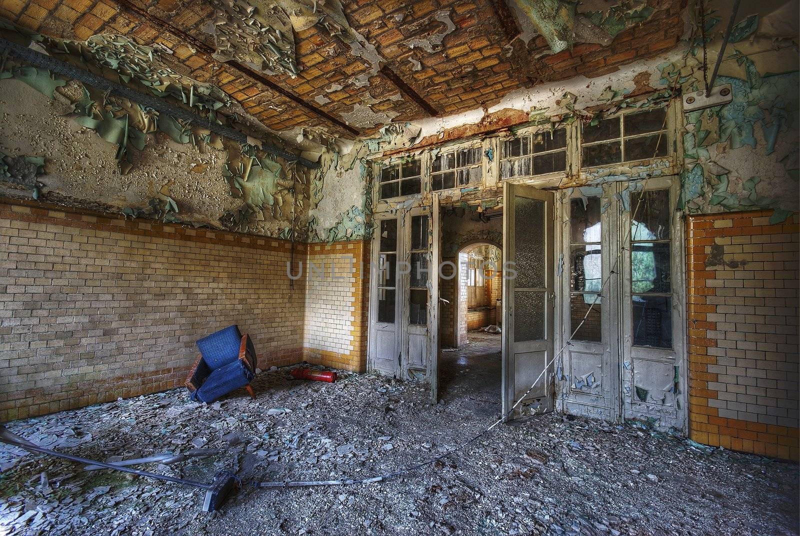 Room in an abandoned building with some furniture